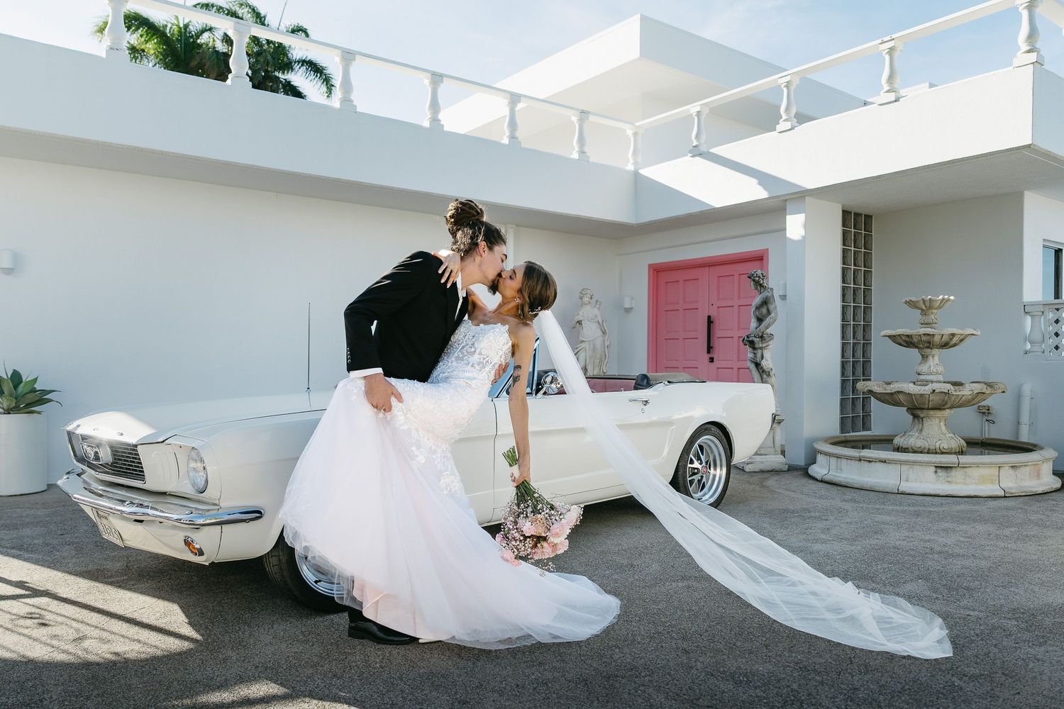 Bride and groom with classic Mustang at A Villa Gail in Cairns