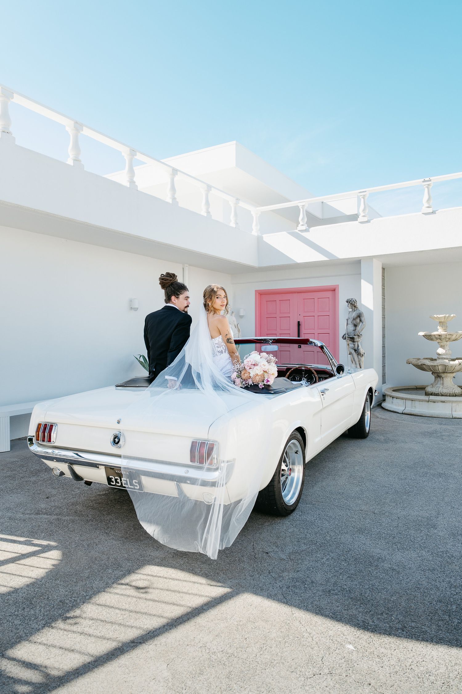Golden hour wedding portraits with classic Mustang in Cairns