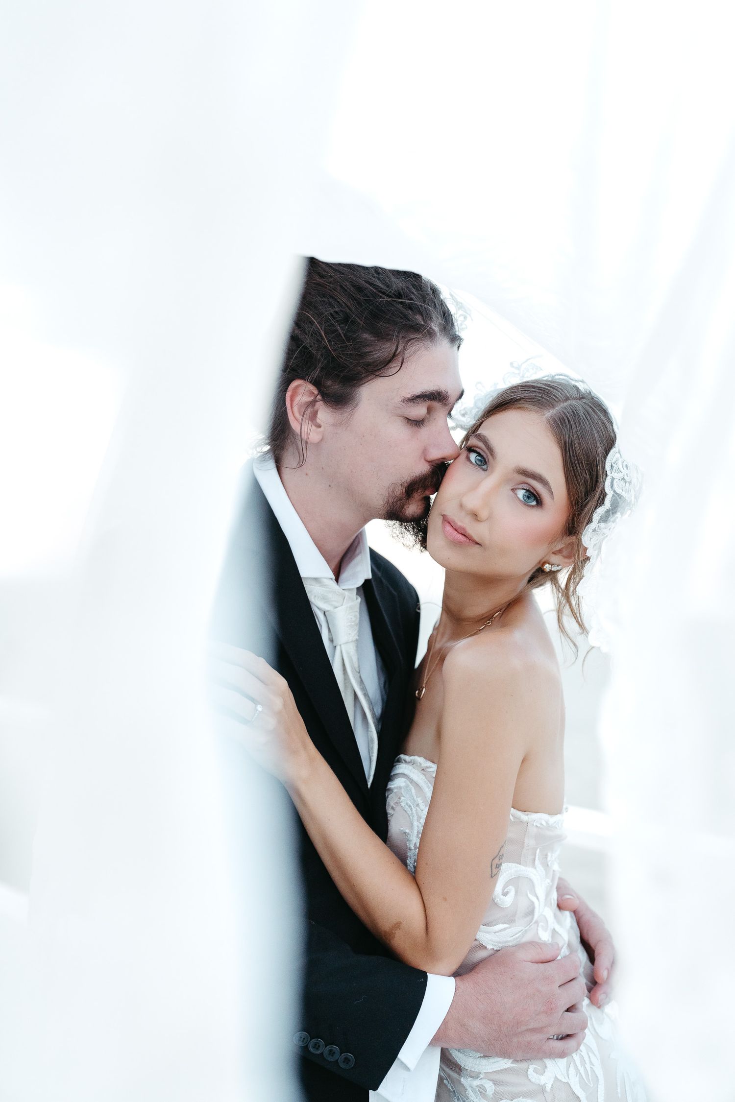 Coastal wedding portraits overlooking the ocean in Cairns