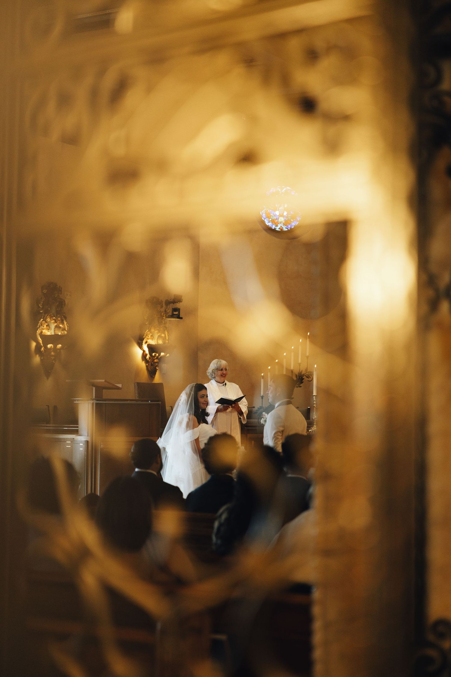 A series of blurred motion photographs showing a bride in white moving through a dimly lit room with warm lighting.