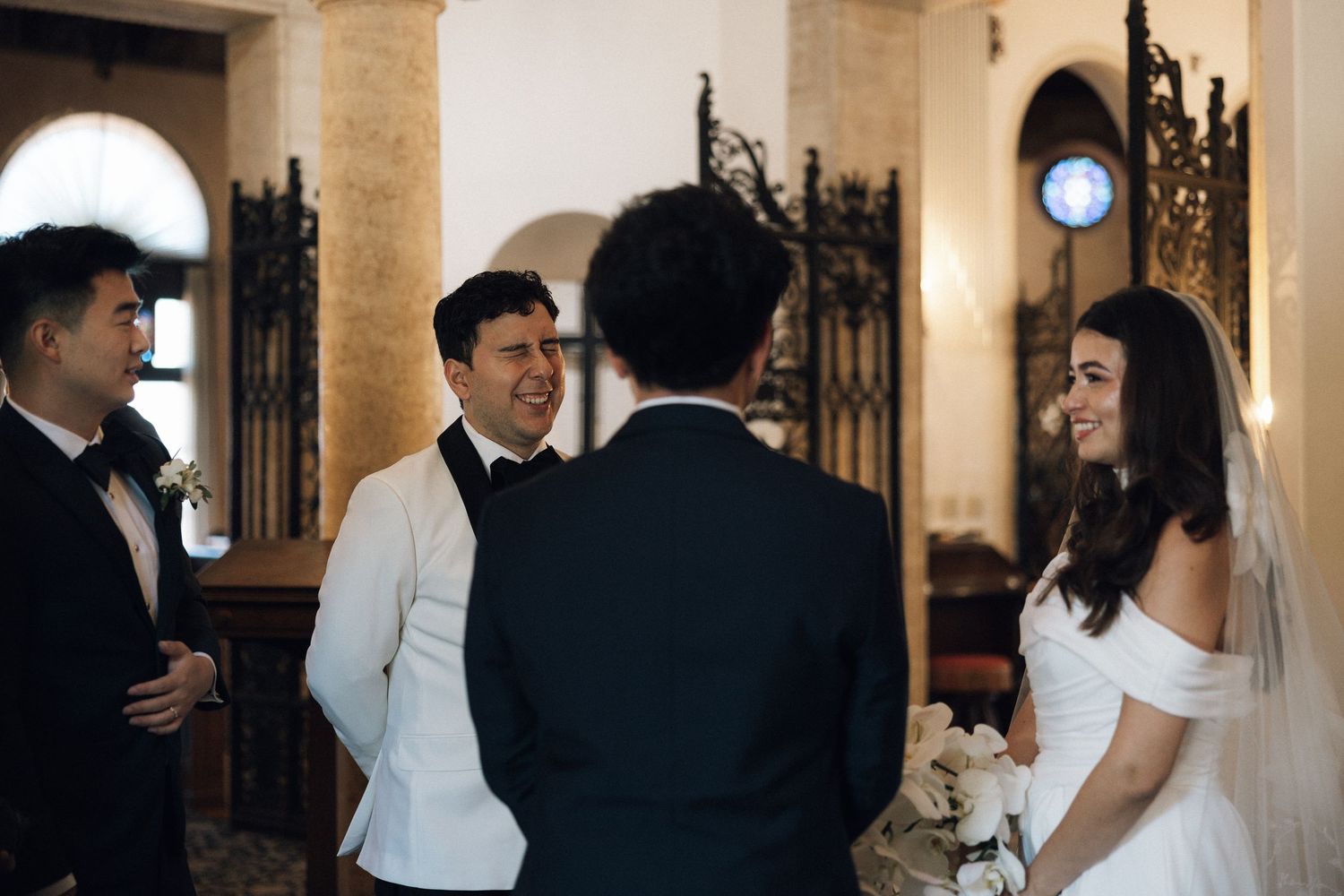 A series of romantic wedding moments captured in an elegant indoor venue with classic architecture and warm lighting.