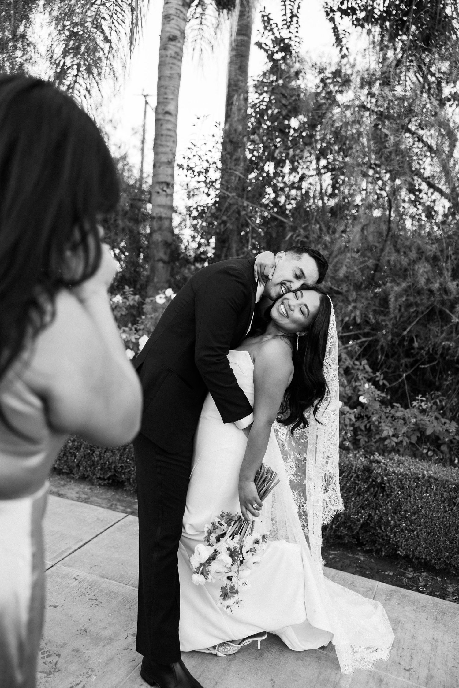 Black and white artistic wedding photography sequence showing a couple in candid dancing poses.