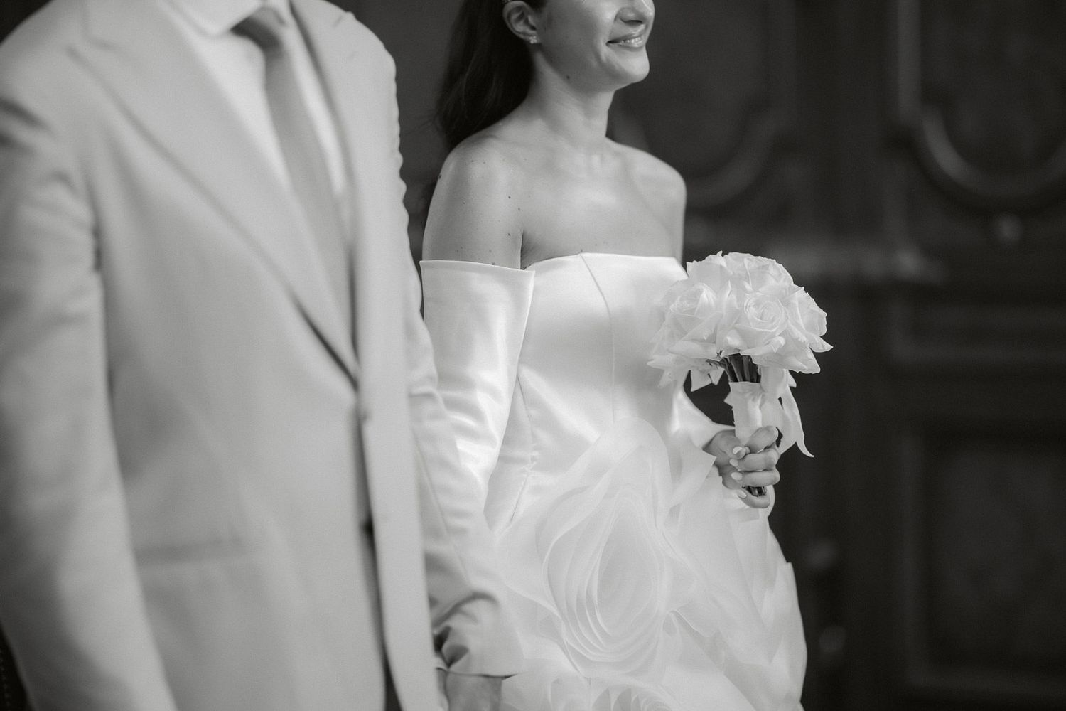 A black and white wedding photo collage showing intimate moments between a bride and groom.