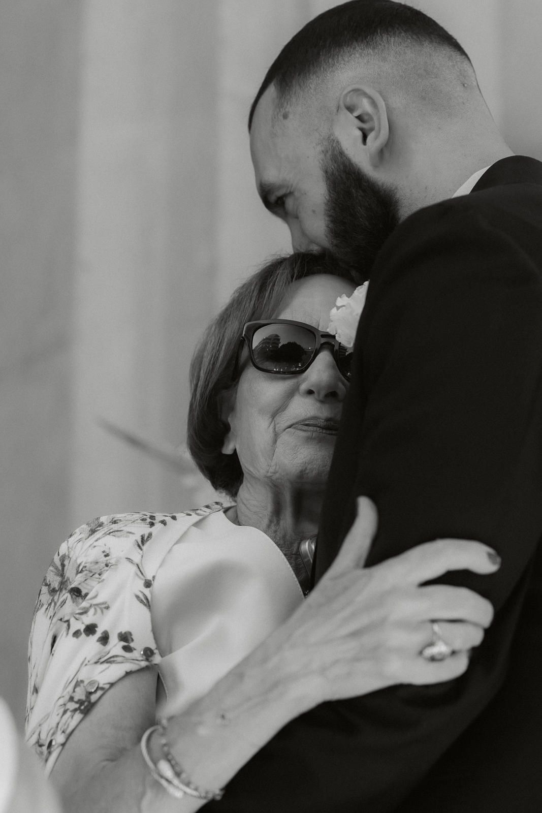 A series of intimate black and white photos showing an emotional embrace between two people.