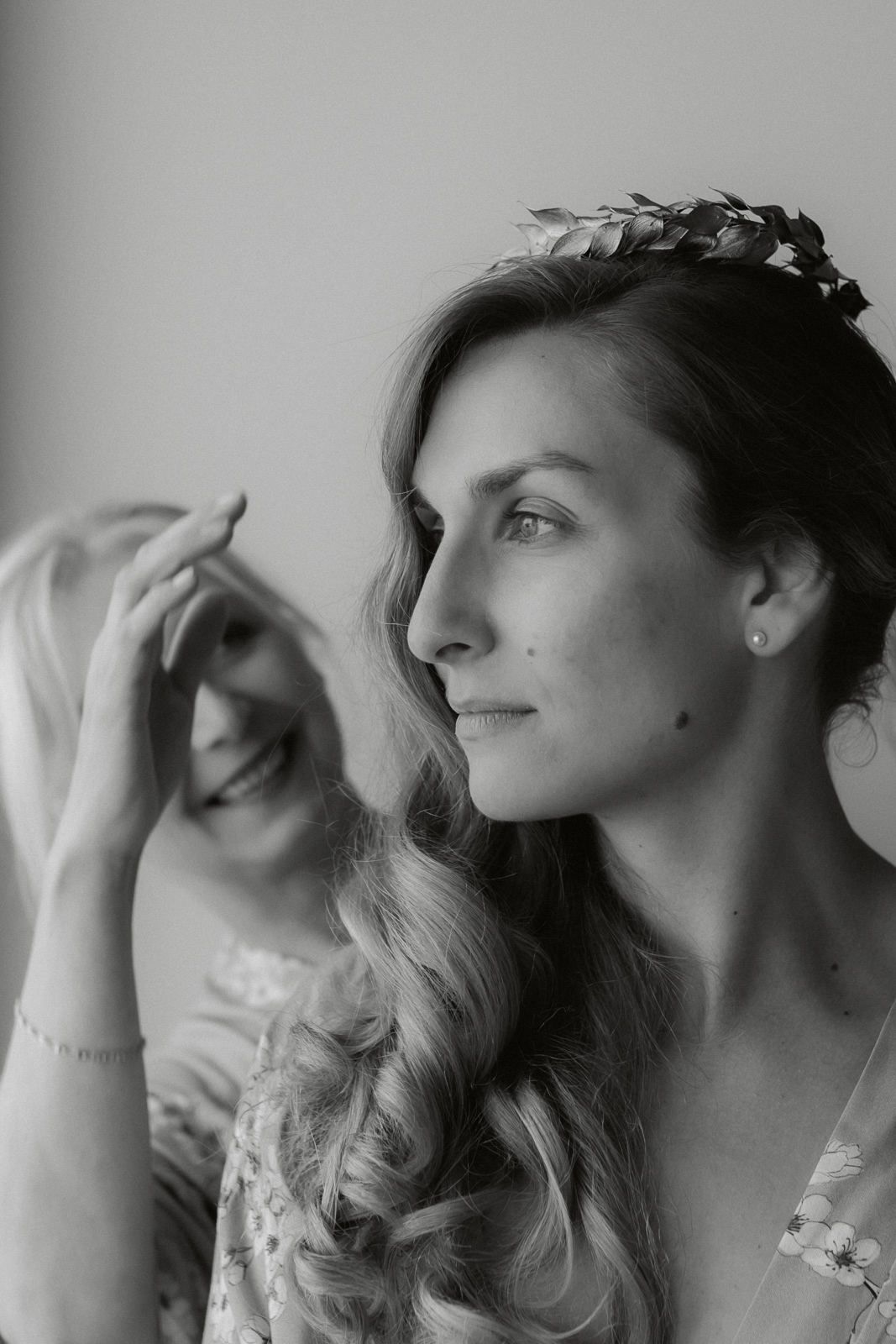 Artistic black and white portrait series showing profile views with elegant hairstyling.