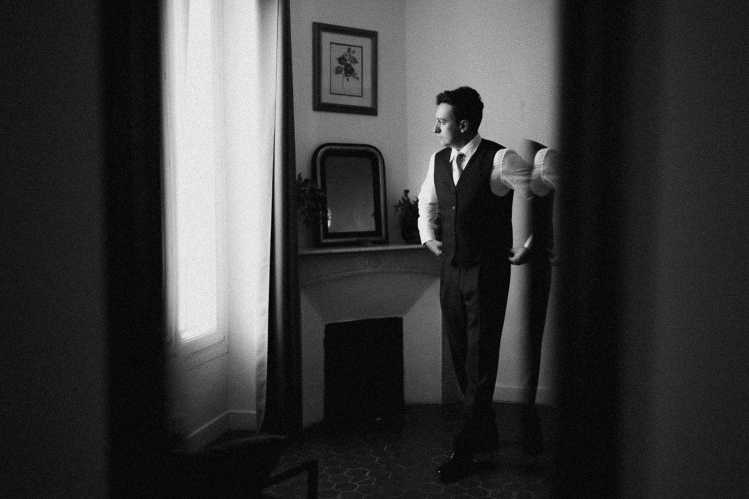 A dramatic black and white photo sequence shows a person standing in a dimly lit room near a window.