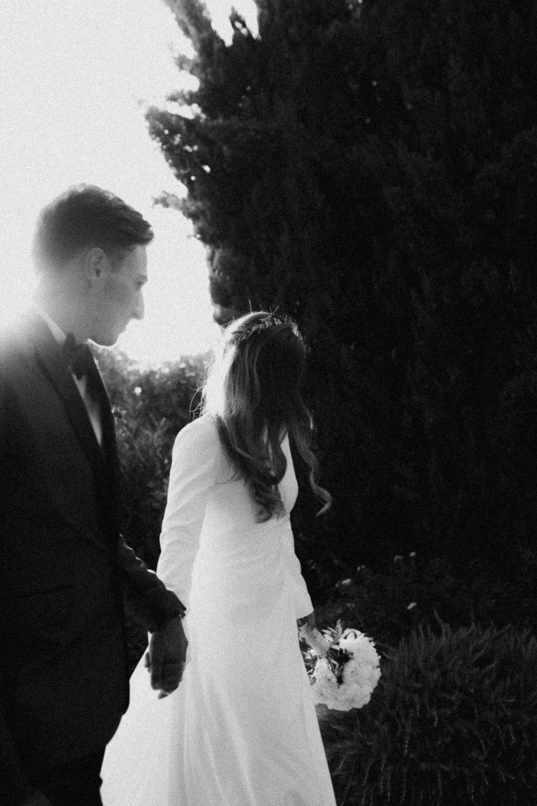 A romantic black and white photo series showing a couple in silhouette against a dreamy outdoor backdrop.