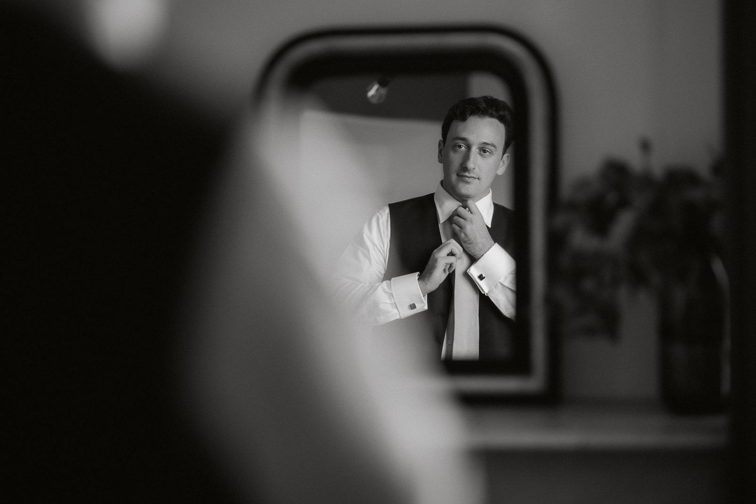A series of black and white photos arranged in a horizontal strip showing various candid moments and portraits.