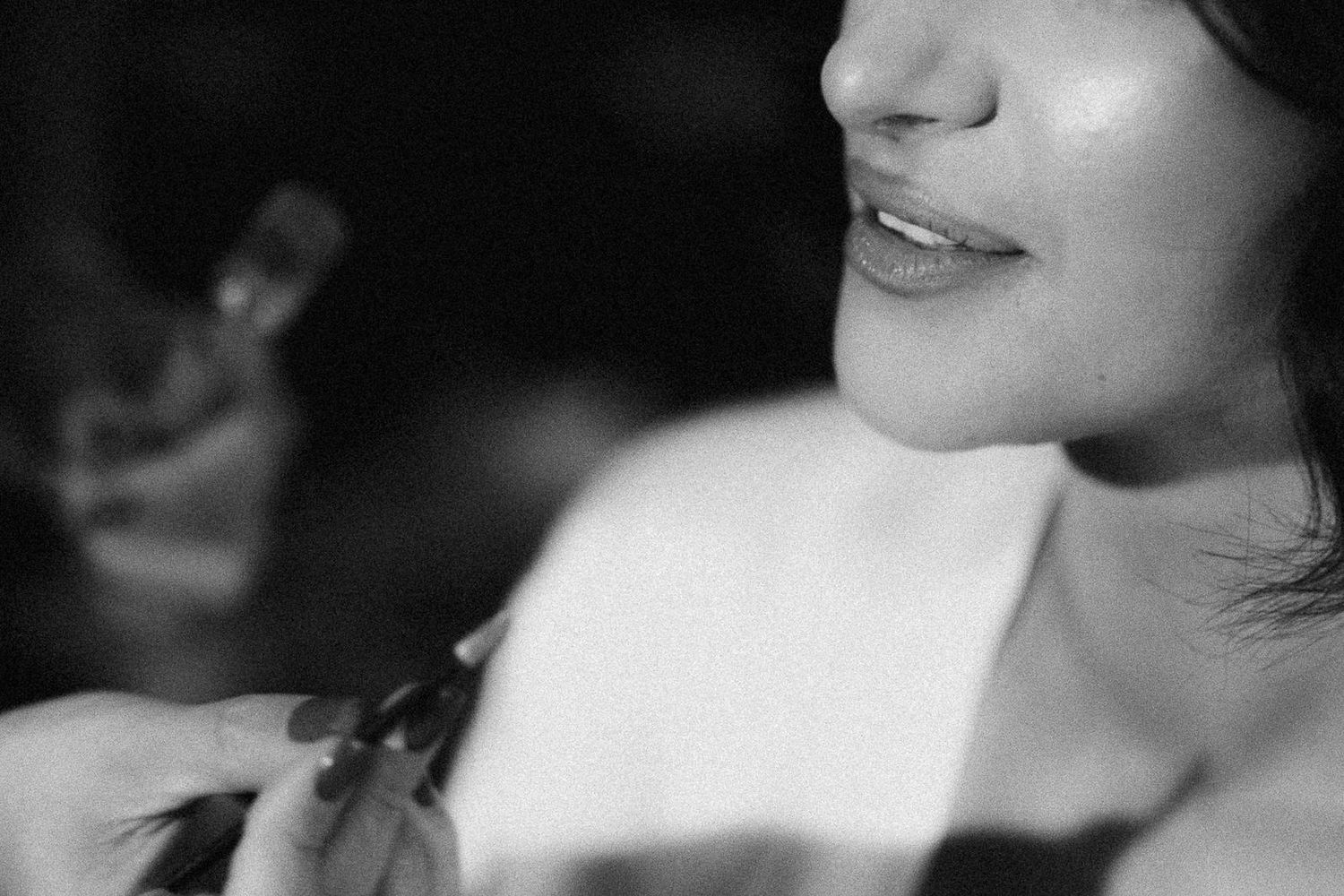 Black and white close-up photograph showing a series of facial features in a repeating pattern.