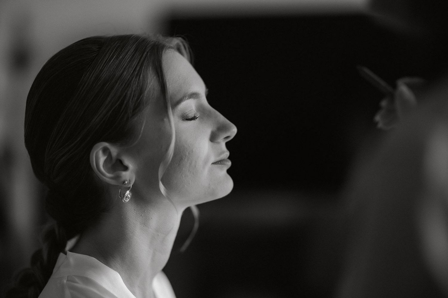 A series of black and white profile portraits showing a person with their head tilted back in different poses.