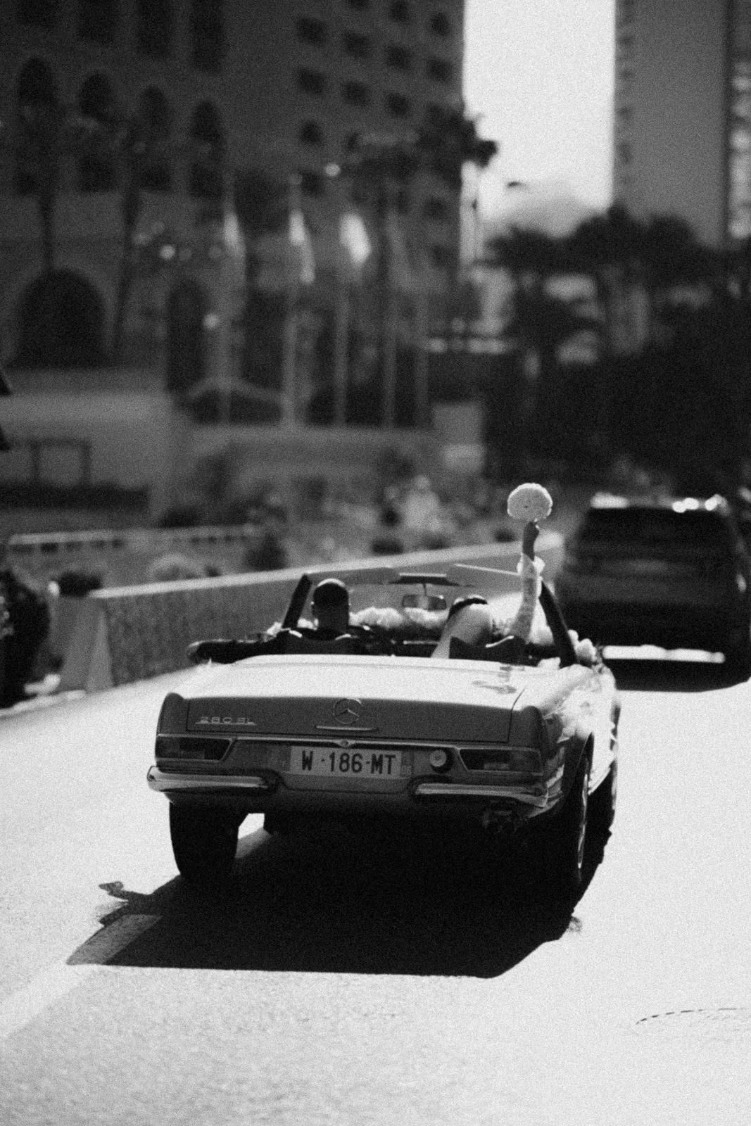 Black and white artistic photo series showing vintage cars on a street in diminishing perspective.