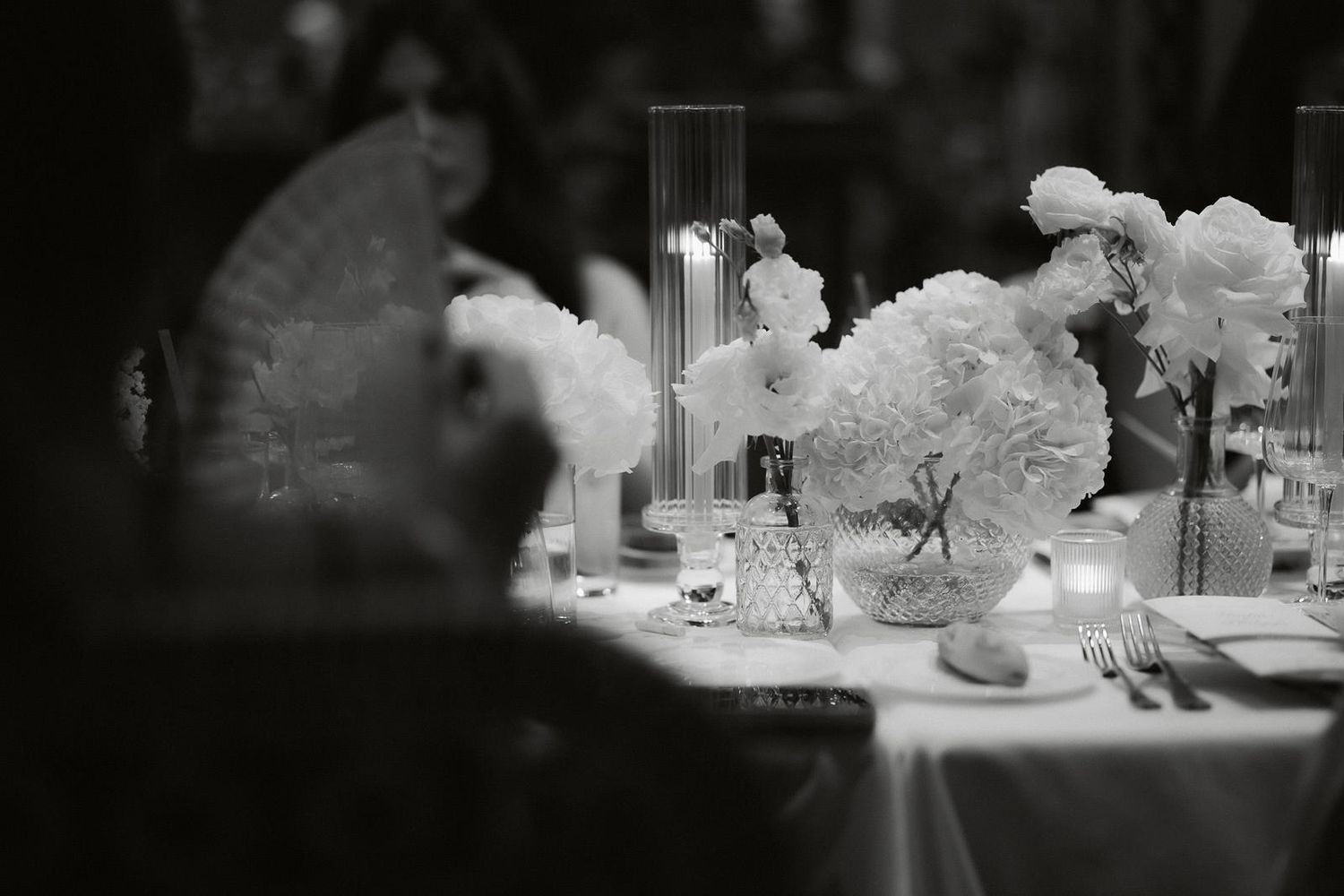 A collection of miniature architectural models or dioramas displayed in black and white monochrome.