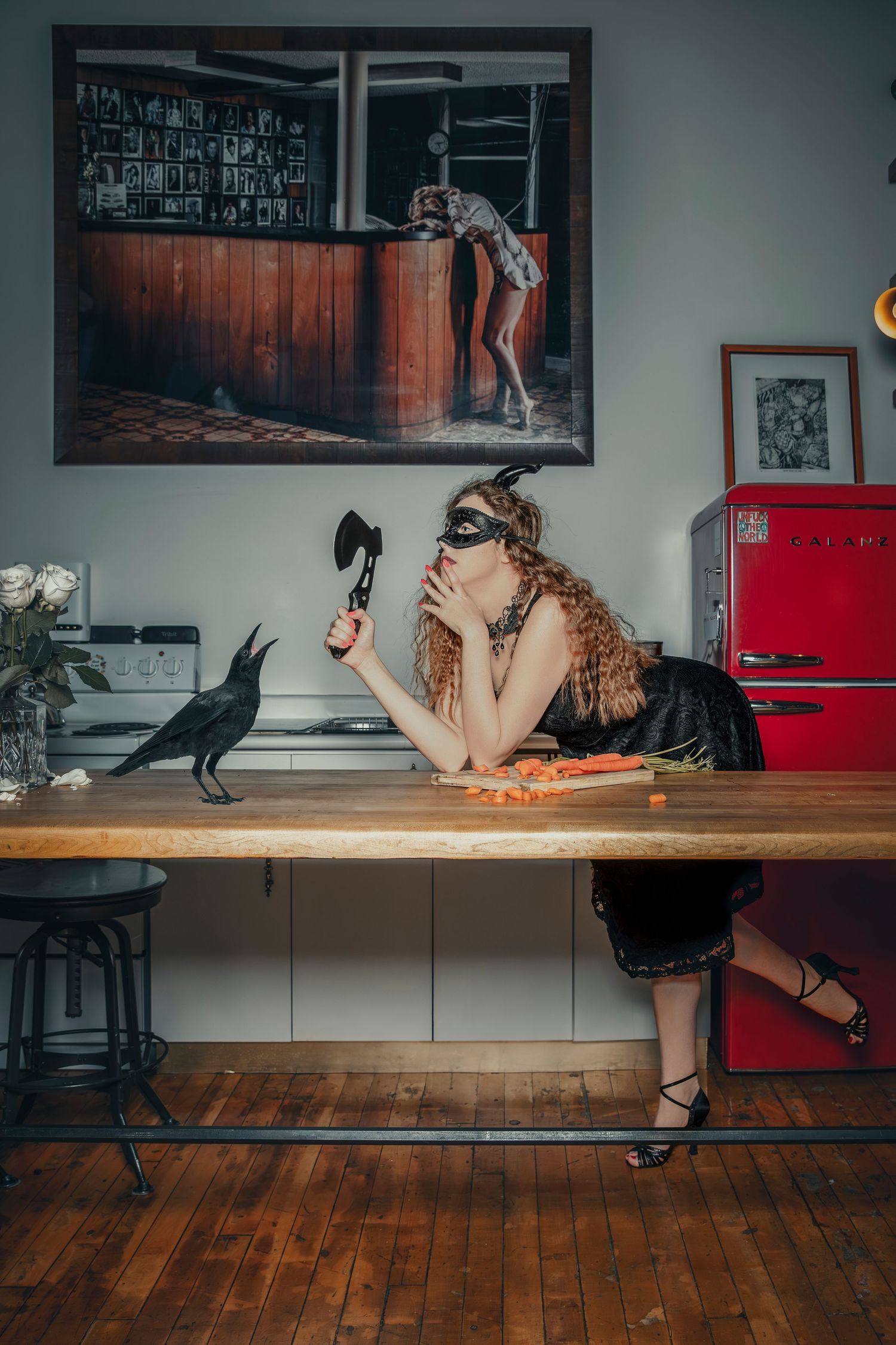 Artistic scene with masked figure at wooden table while black bird perches nearby.