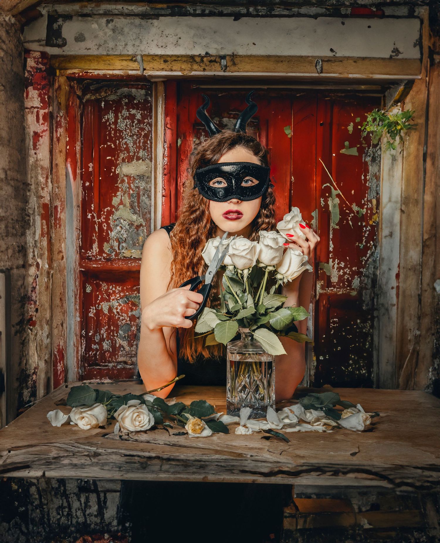 Masked figure with white roses in vintage setting against weathered red door.