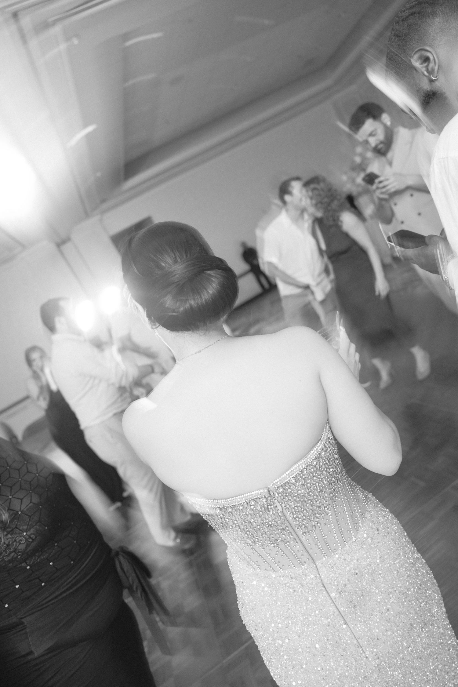 Close-up details of a sparkly white wedding dress bodice.