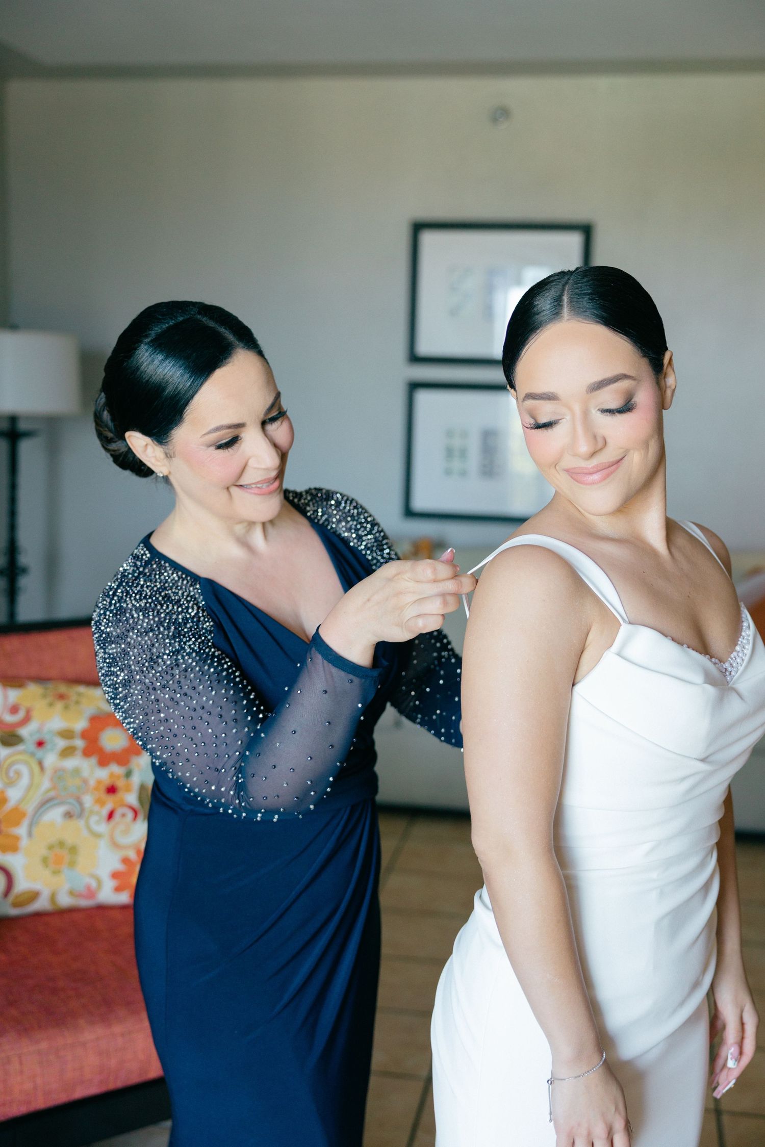 Sequence showing dress fitting with navy blue beaded bodice and white gown.