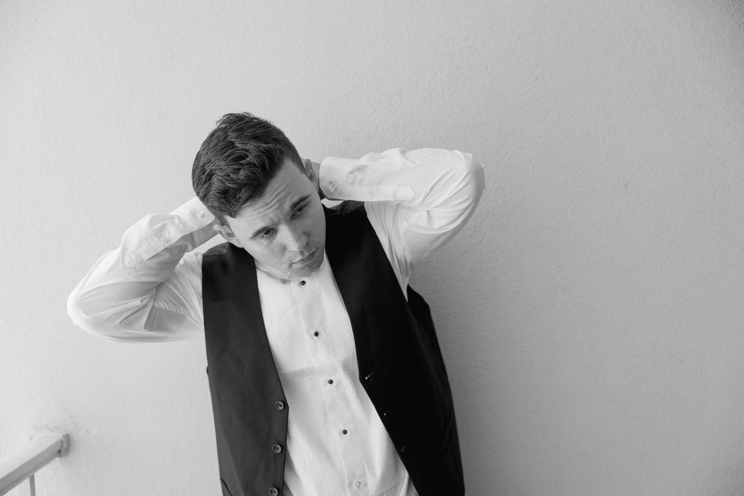 Black and white portraits showing formal attire details and accessories.