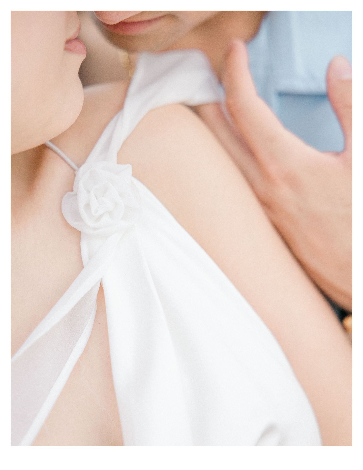 Close-up details of white fabric and delicate clothing textures.