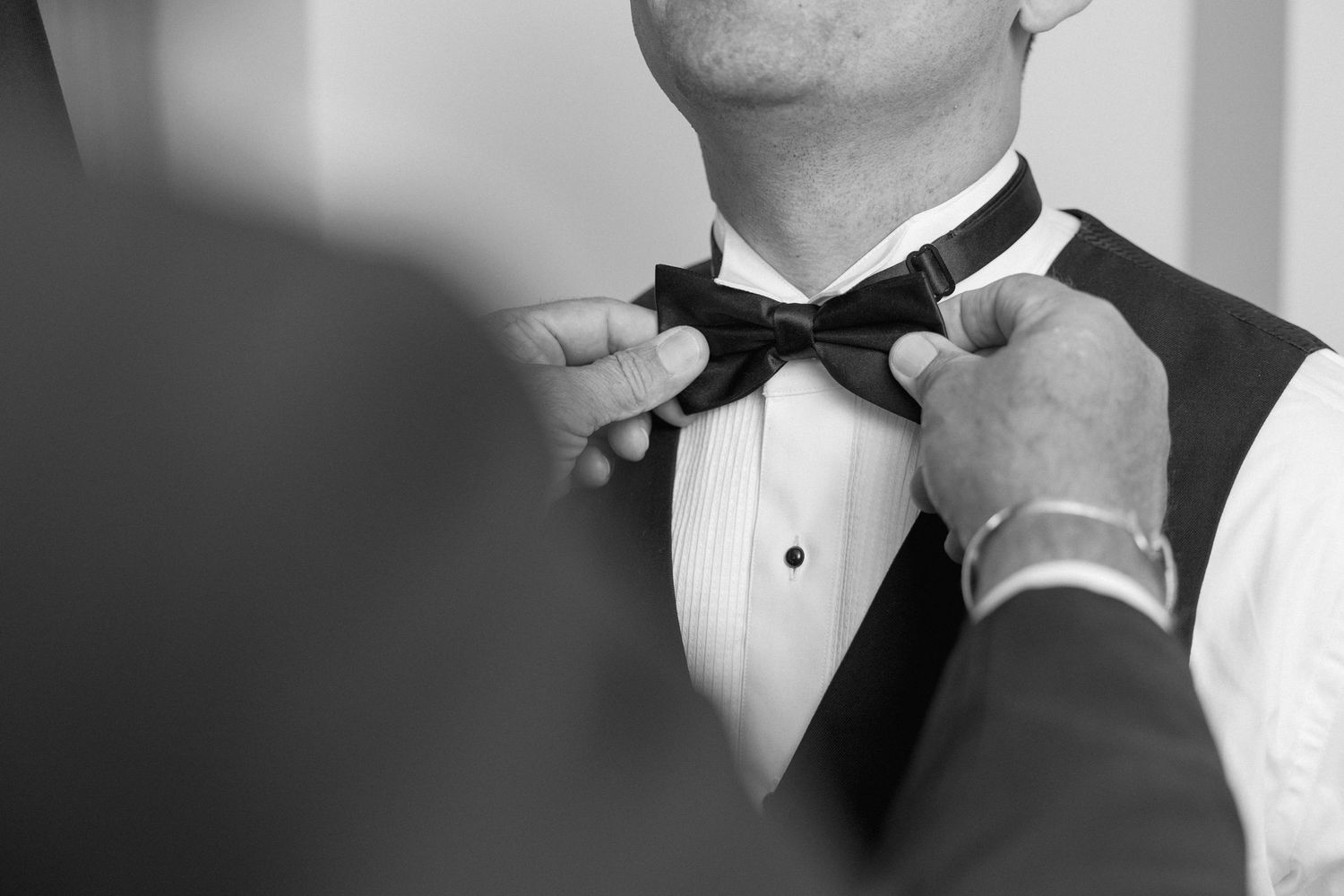 Series of black and white close-ups focusing on formal bow tie and collar.