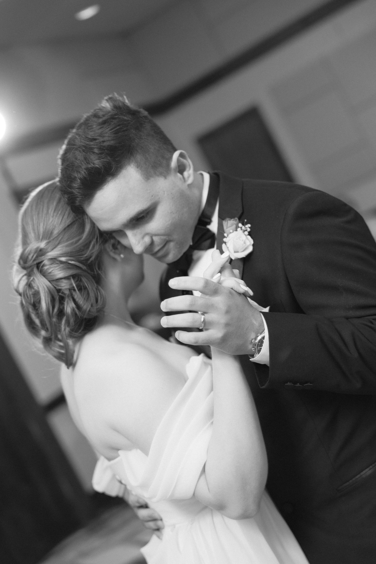 Black and white sequence of newlyweds sharing an intimate dance moment.