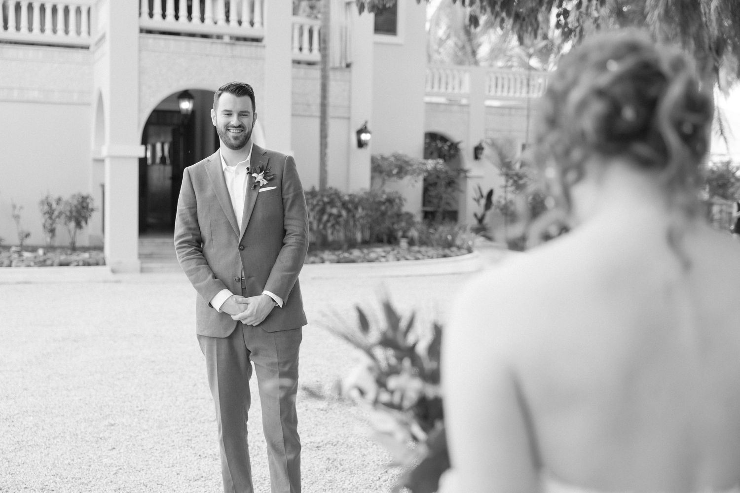First look moment captured in black and white at an elegant venue.