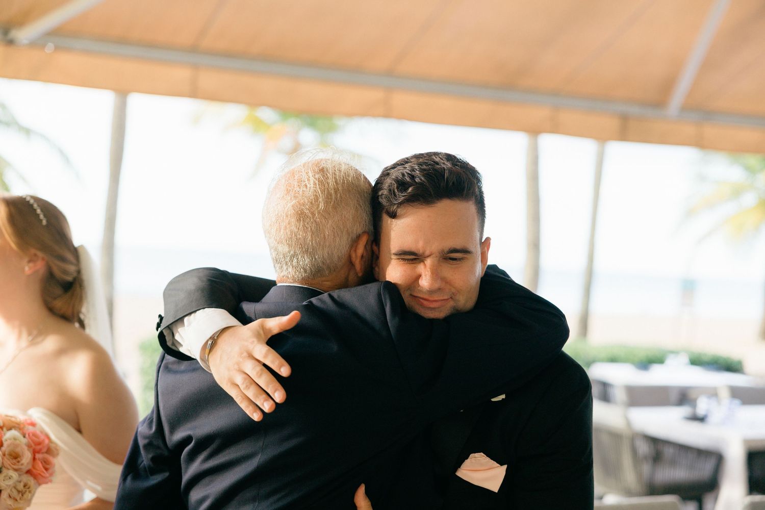 Emotional embraces shared during wedding celebration.