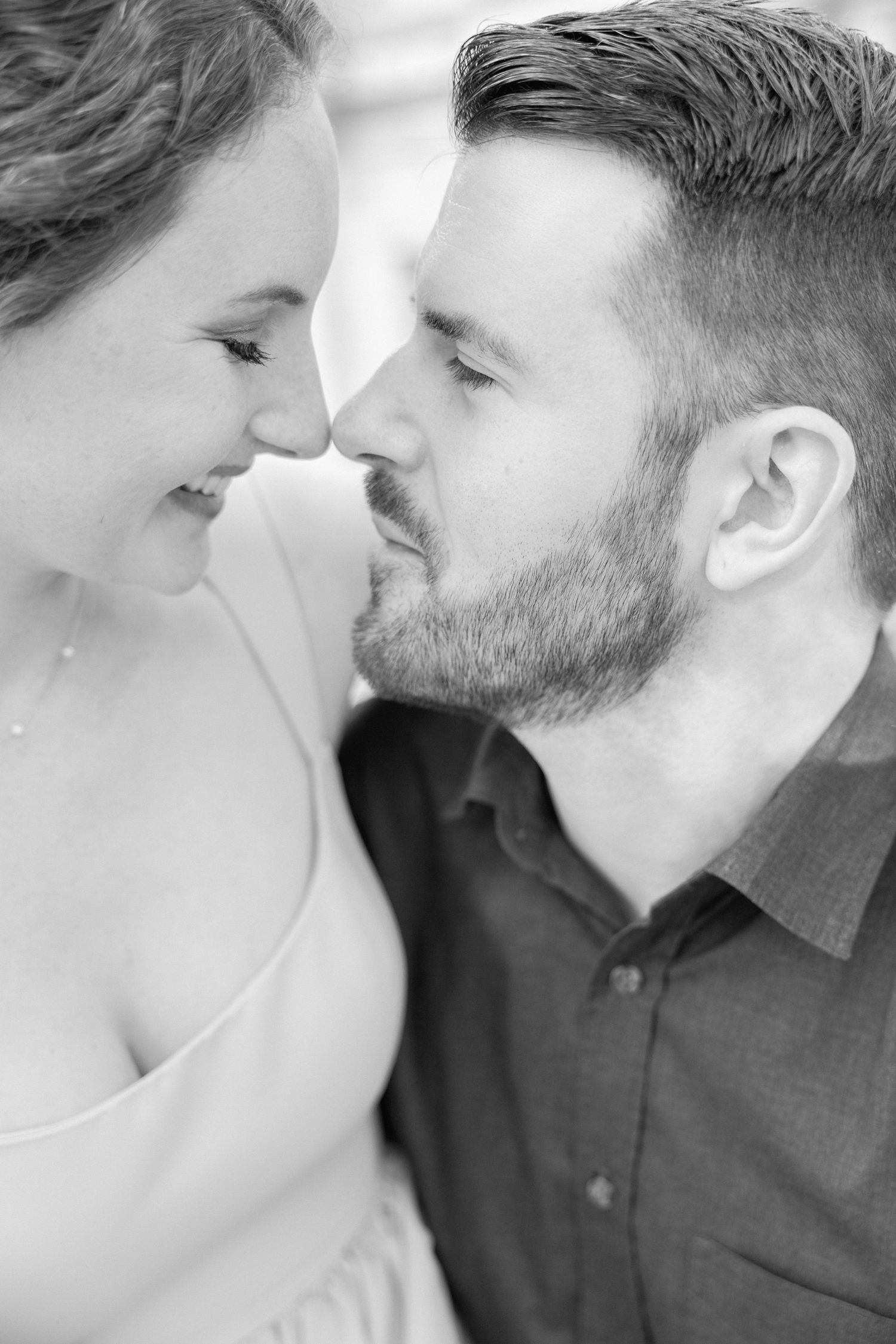 Intimate black and white close-up portrait of a romantic couple.