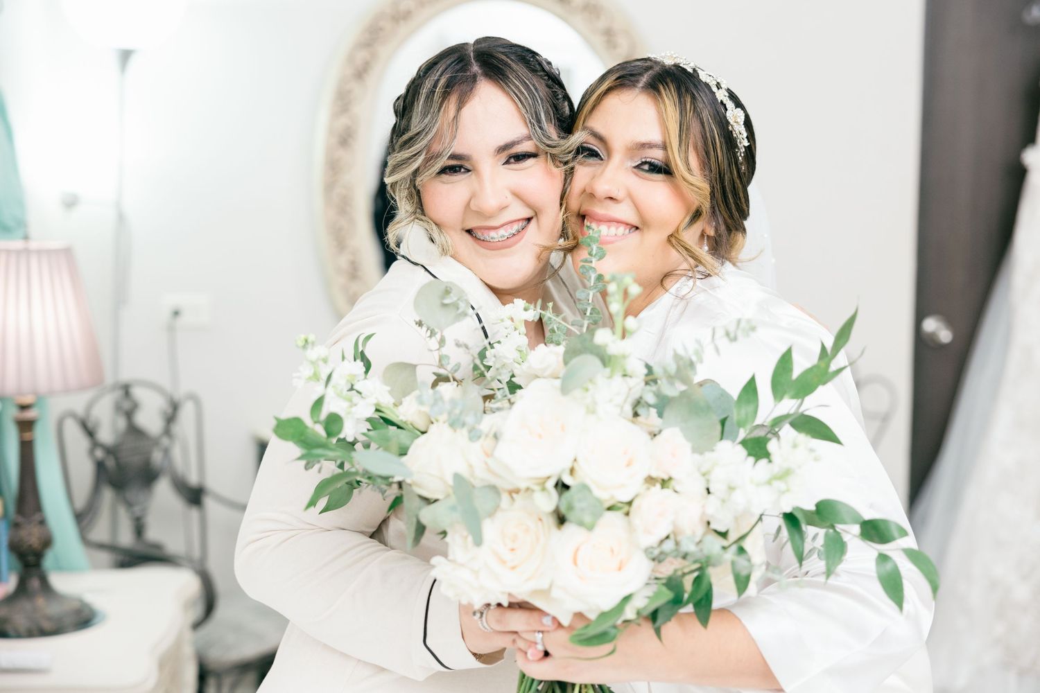 An elegant wedding celebration with white floral arrangements and romantic lighting.