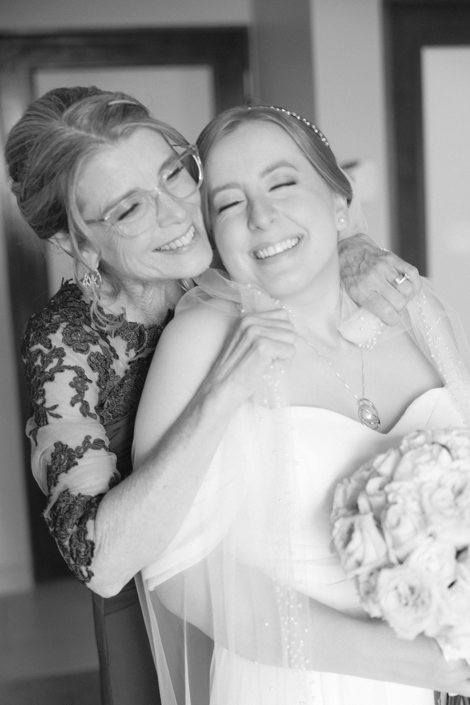 Artistic black and white series of intimate wedding day moments with floral bouquet.