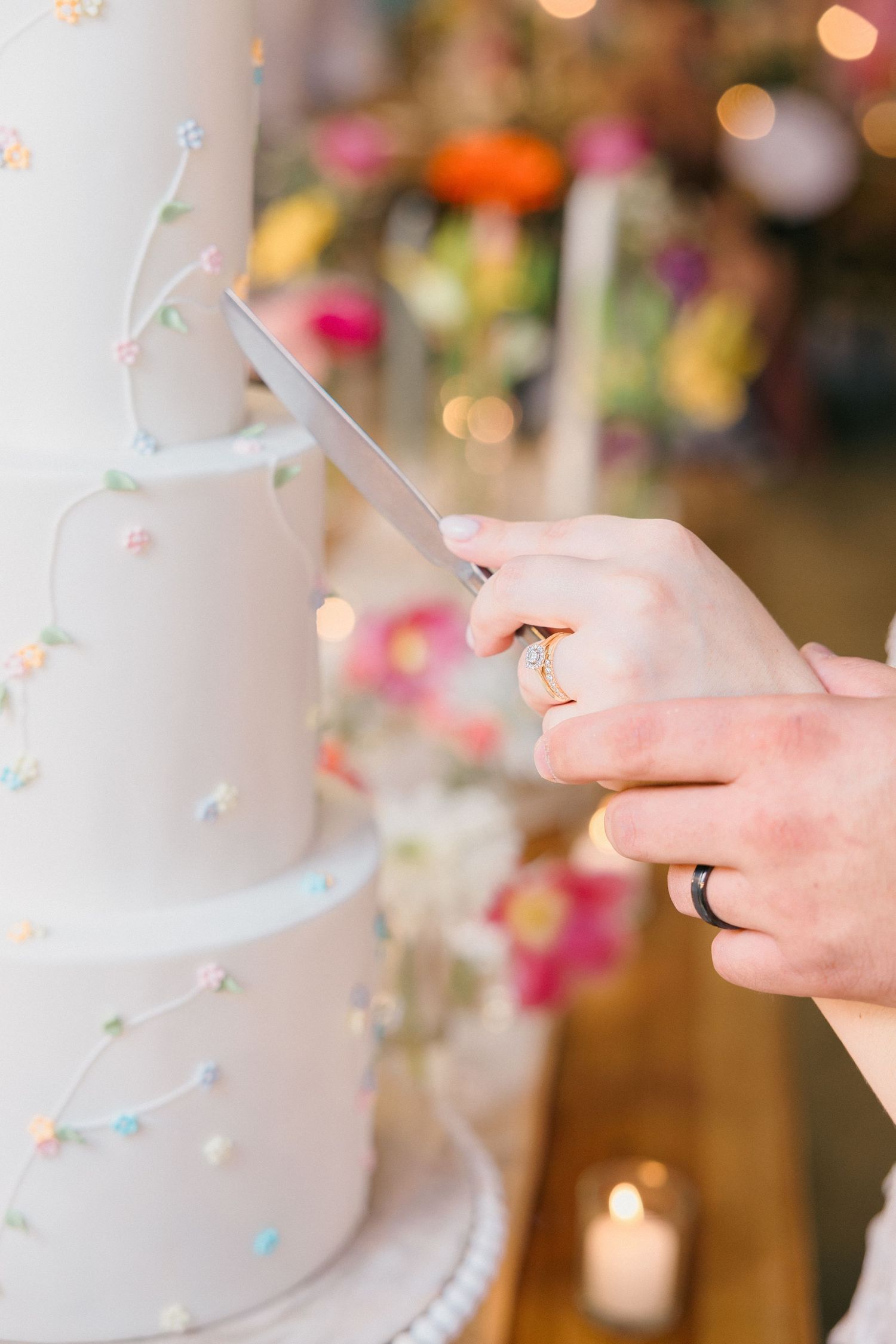 Delicate details of confetti and sparkles on a white surface with bokeh lighting.