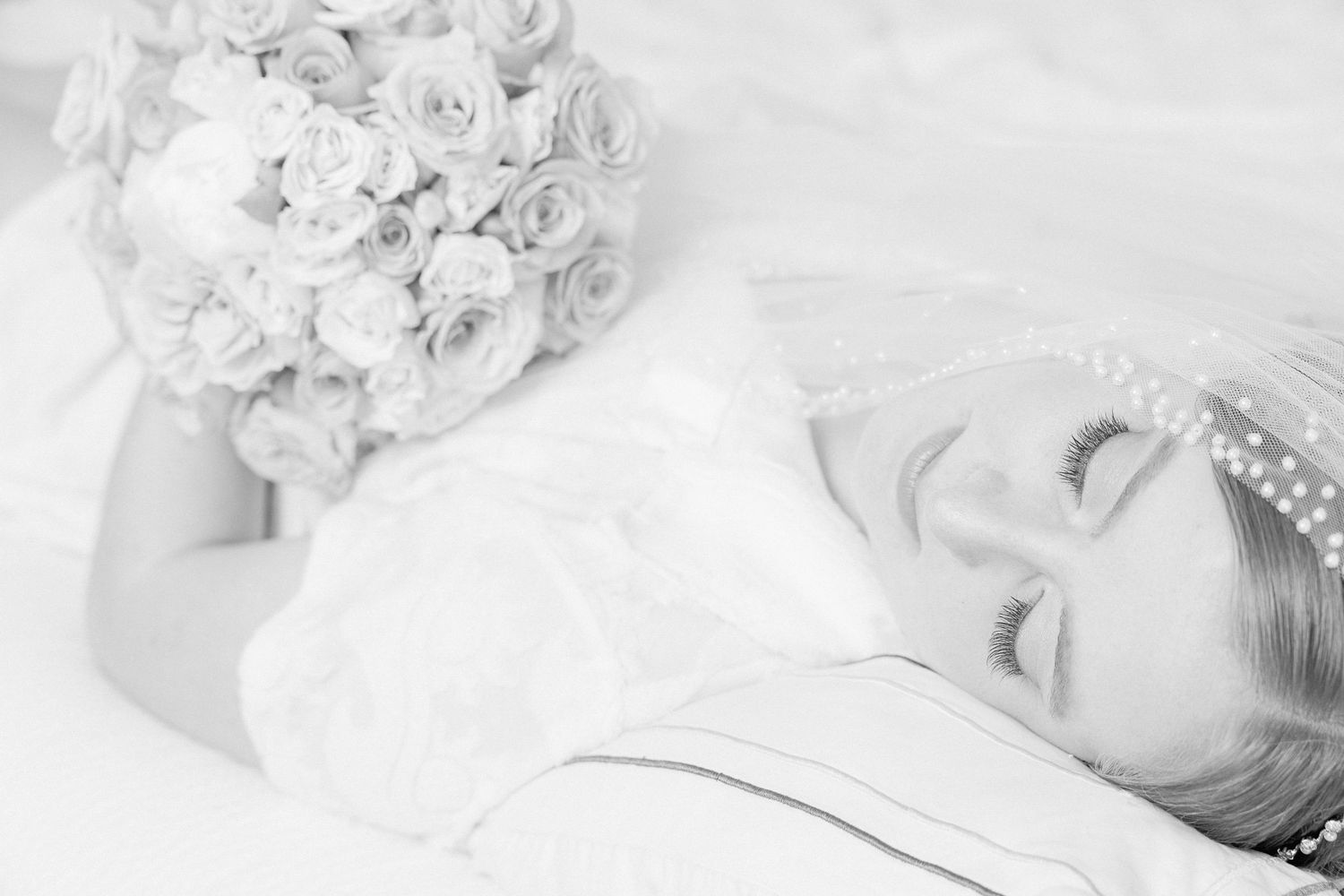 Elegant white floral arrangements captured in soft, dreamy black and white photography.