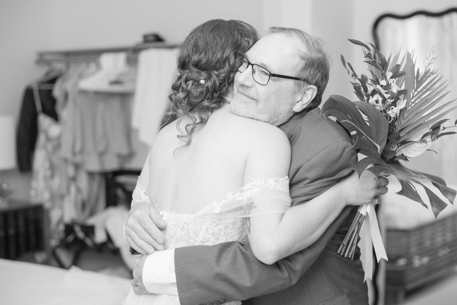 Black and white emotional first look reactions between wedding couple.