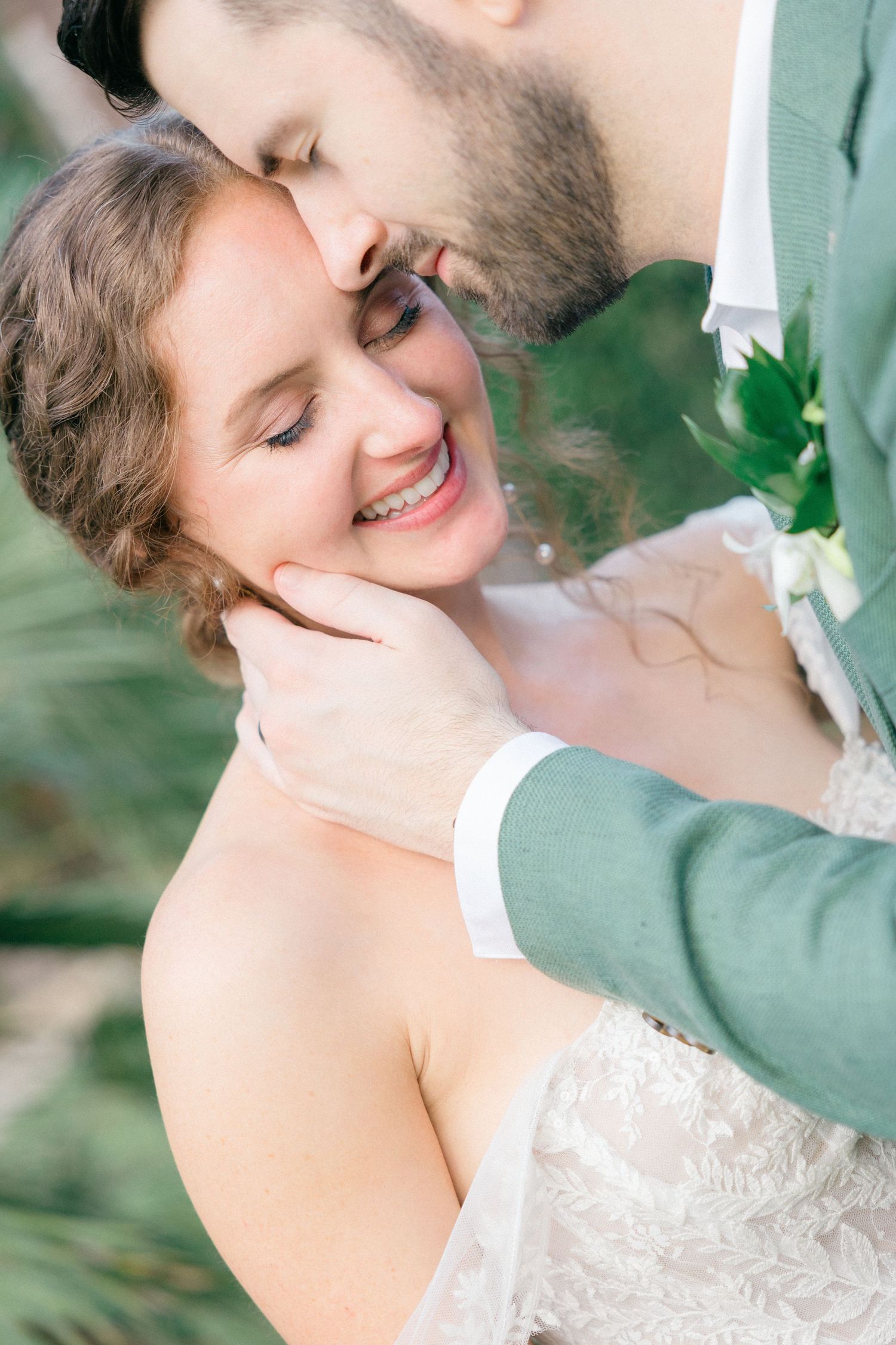 Close-up wedding portraits capture tender moments between the couple.