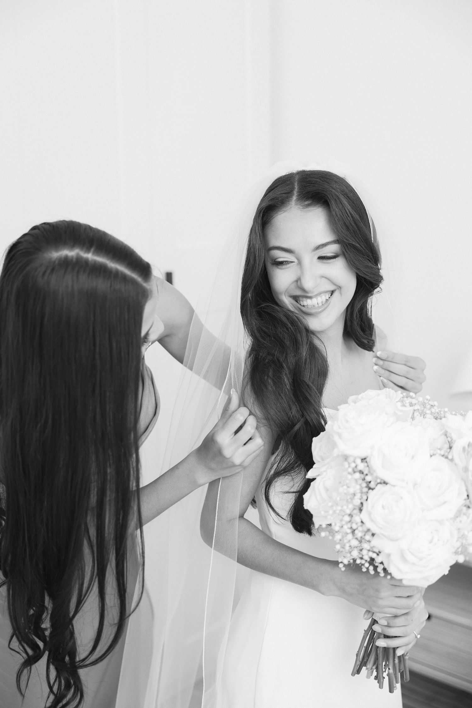 Series of candid black and white bridal portraits showing joyful moments.