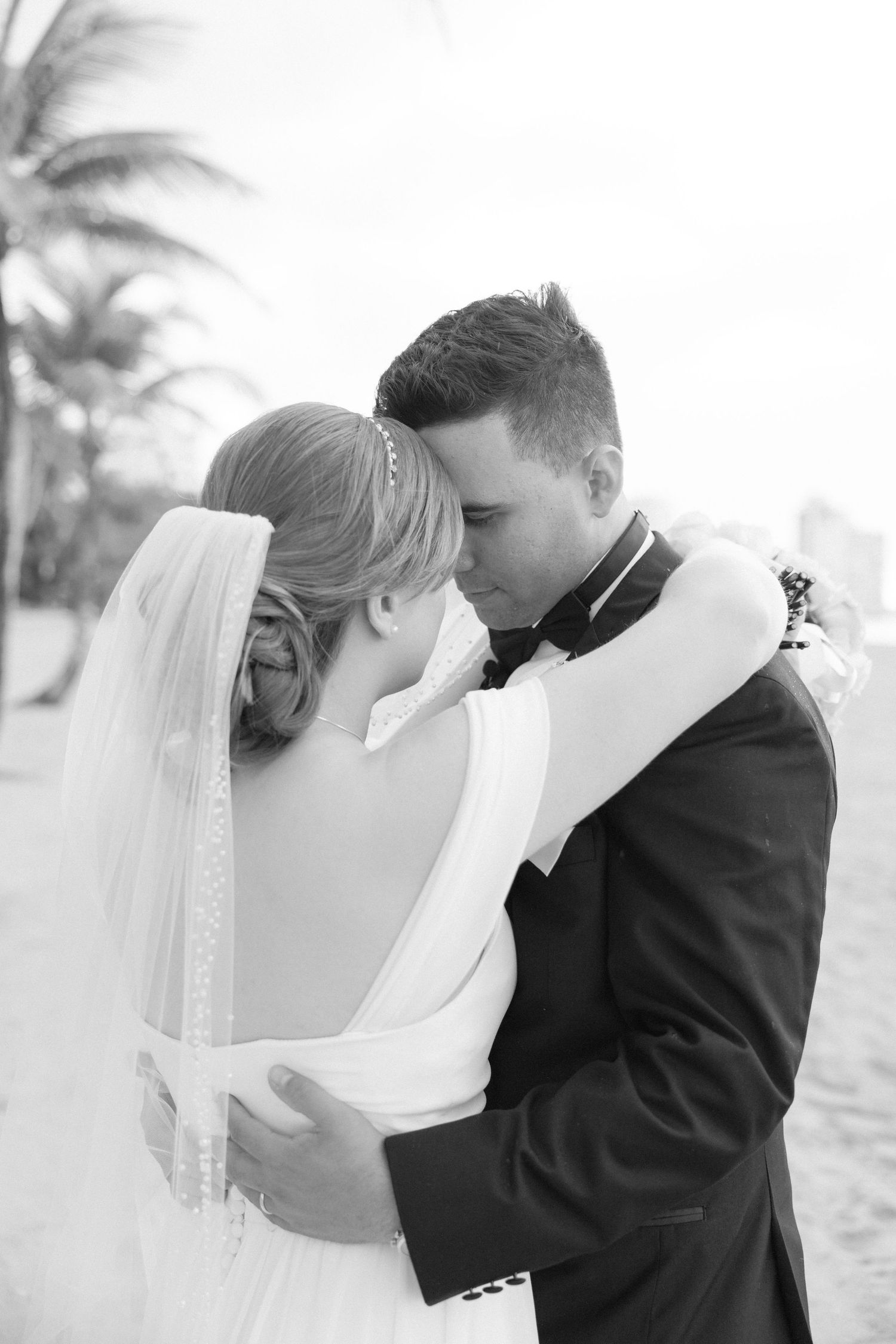 Intimate black and white wedding portraits on a sunny day.
