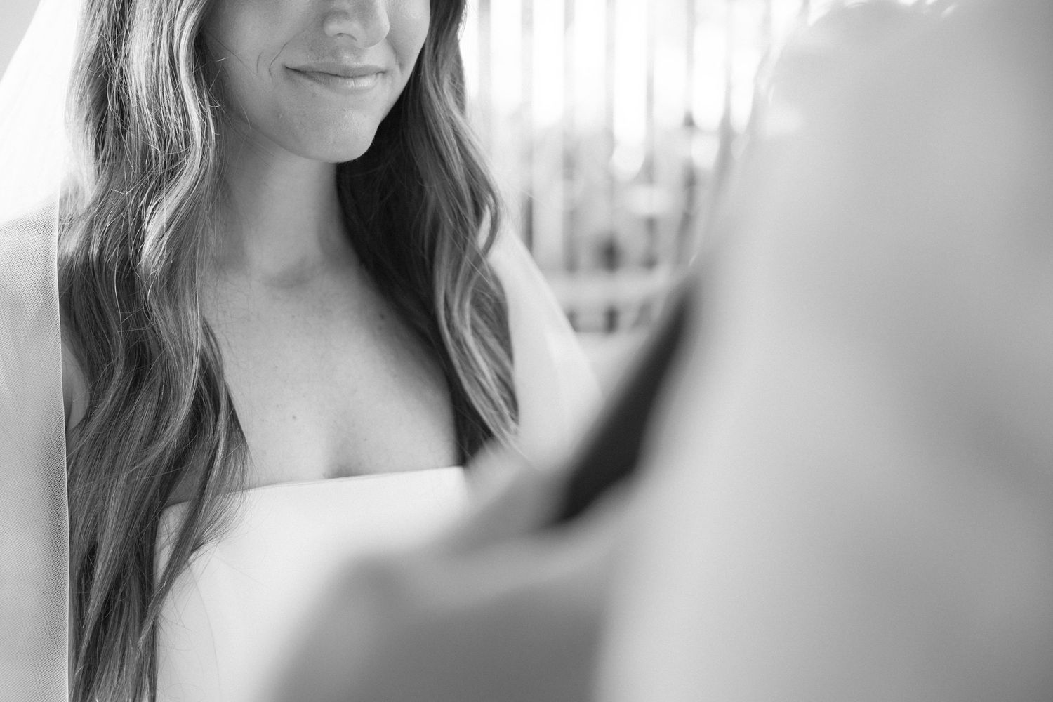 Black and white close-up portrait shots during a wedding ceremony.