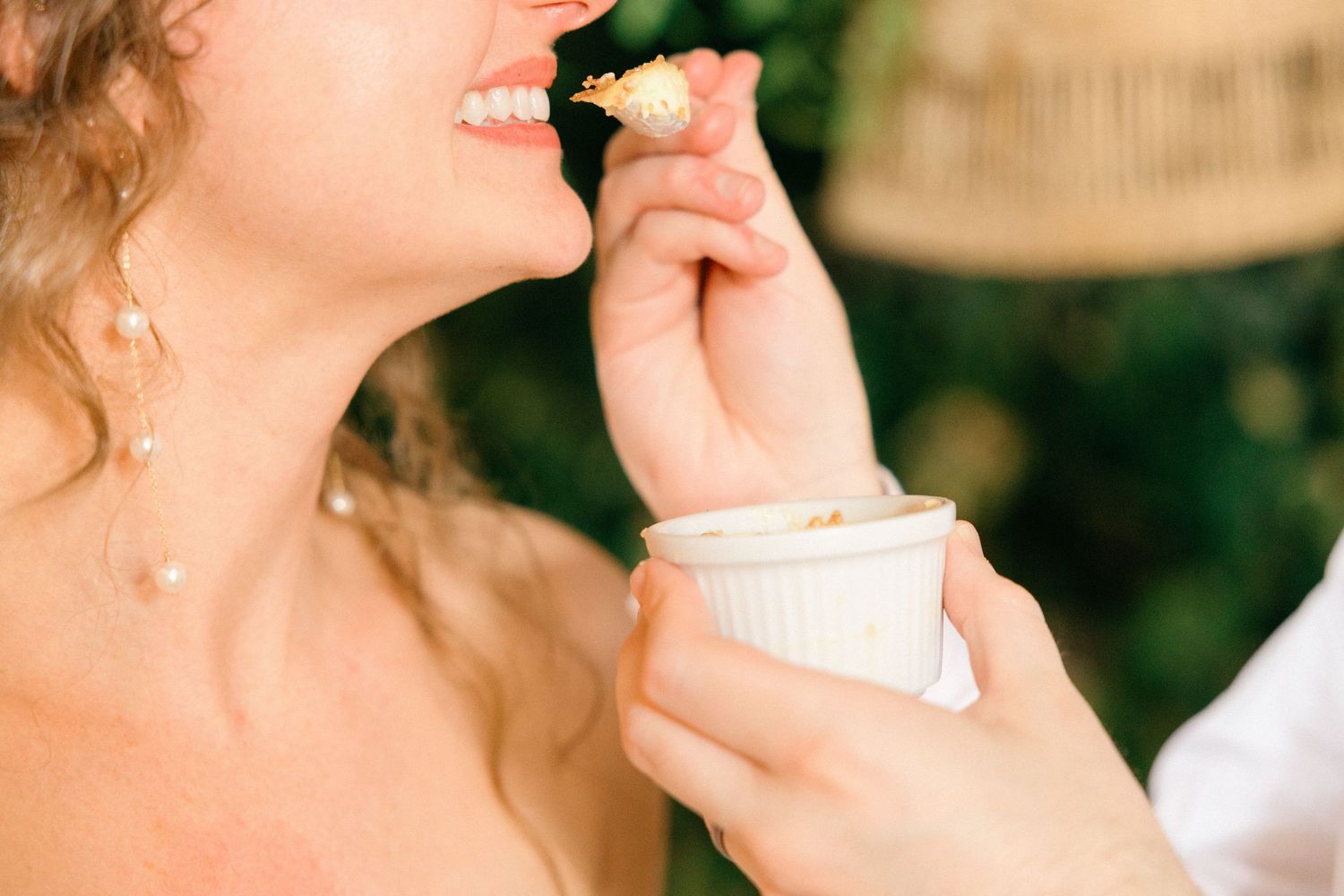 Close-up shots of someone wiping away tears during an emotional wedding moment.