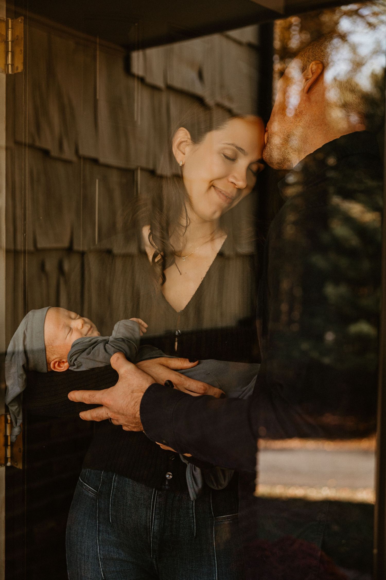 Intimate lifestyle photography session in rustic wooden setting at sunset.