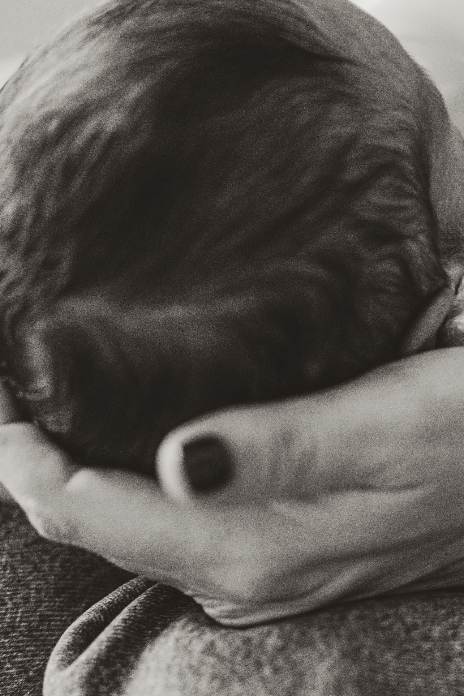 Black and white macro shot of soft hair textures.