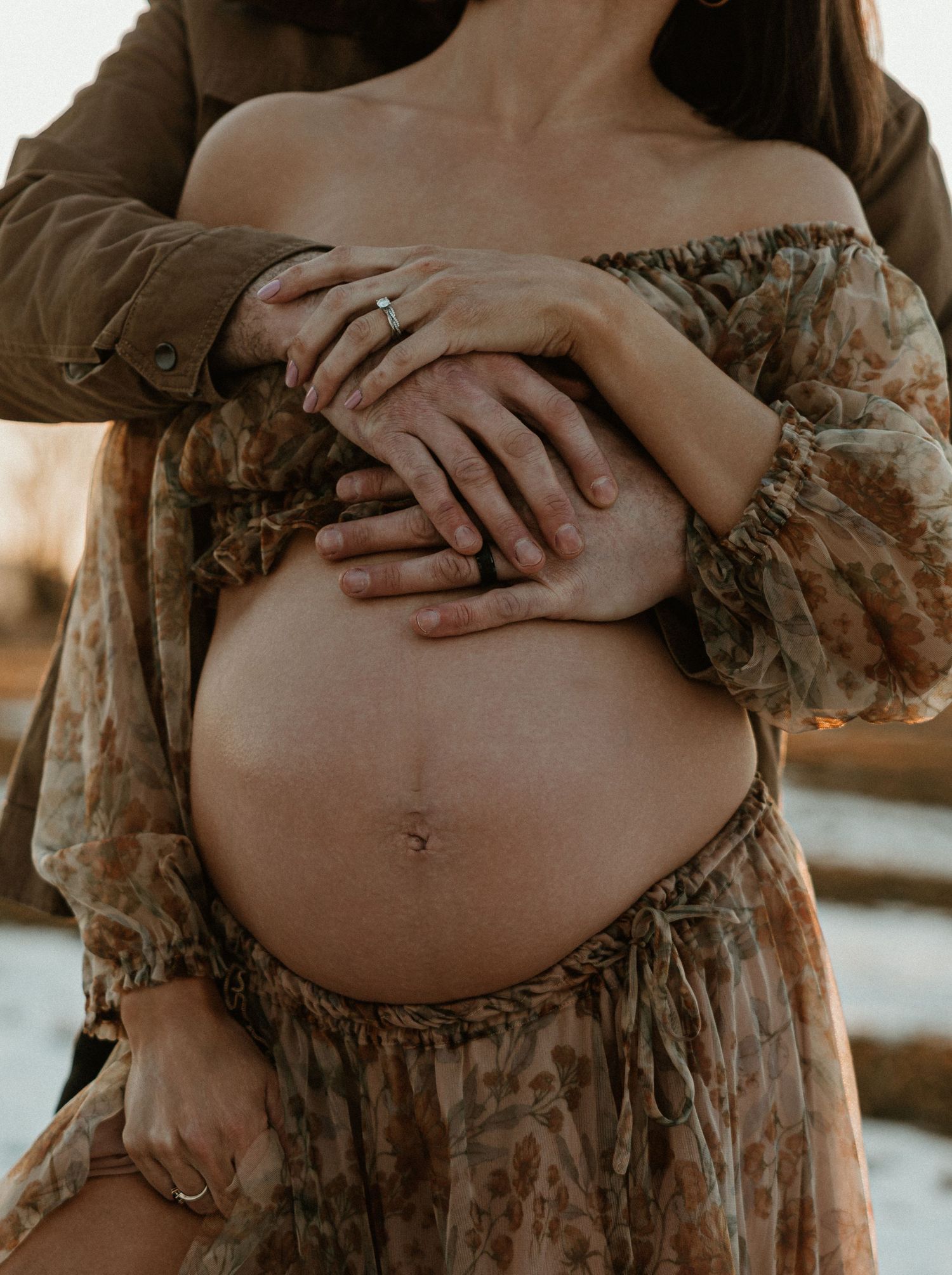 A series of maternity photos showing a pregnant belly in a floral dress against warm lighting.