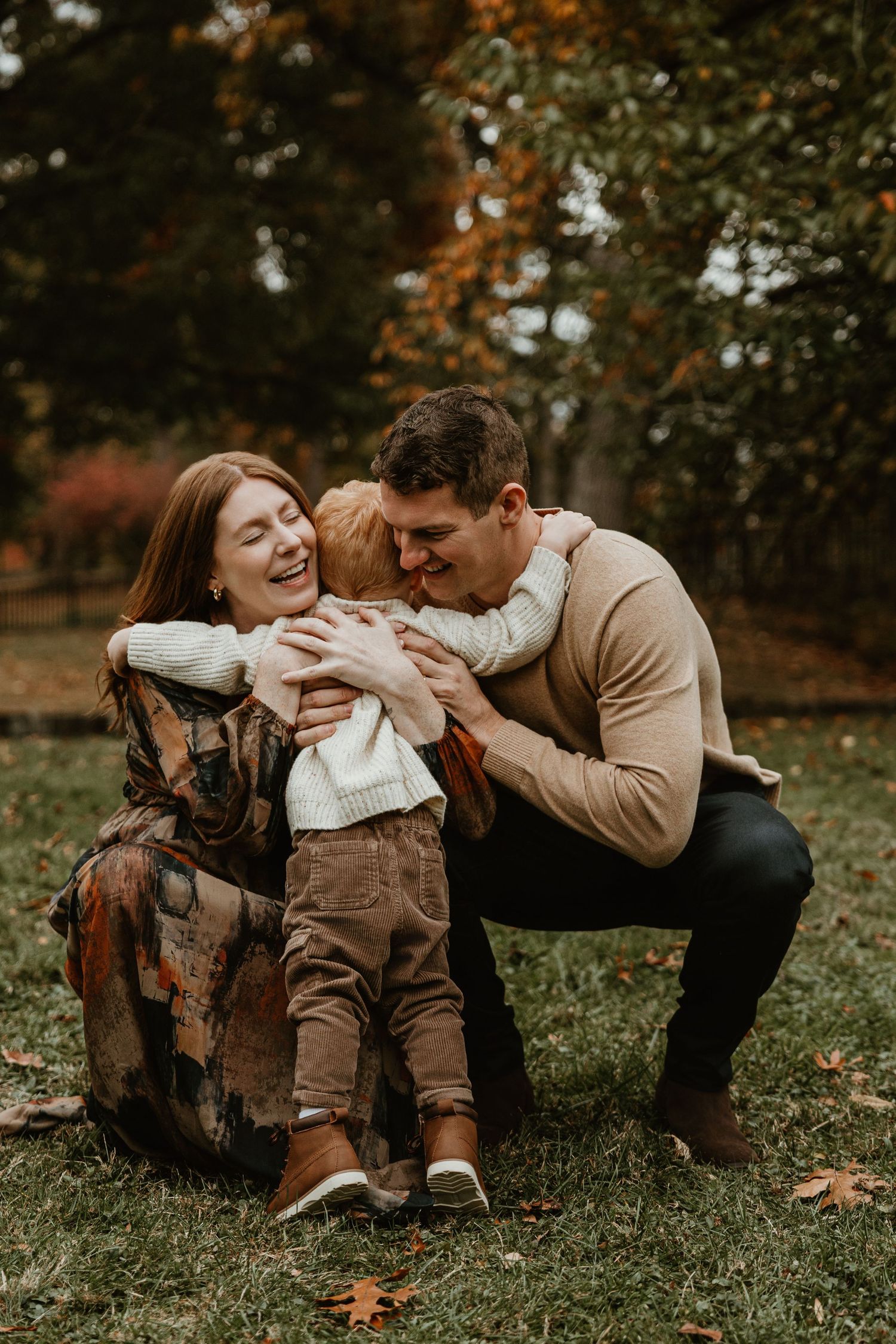 Candid family moments captured in a fall field setting.