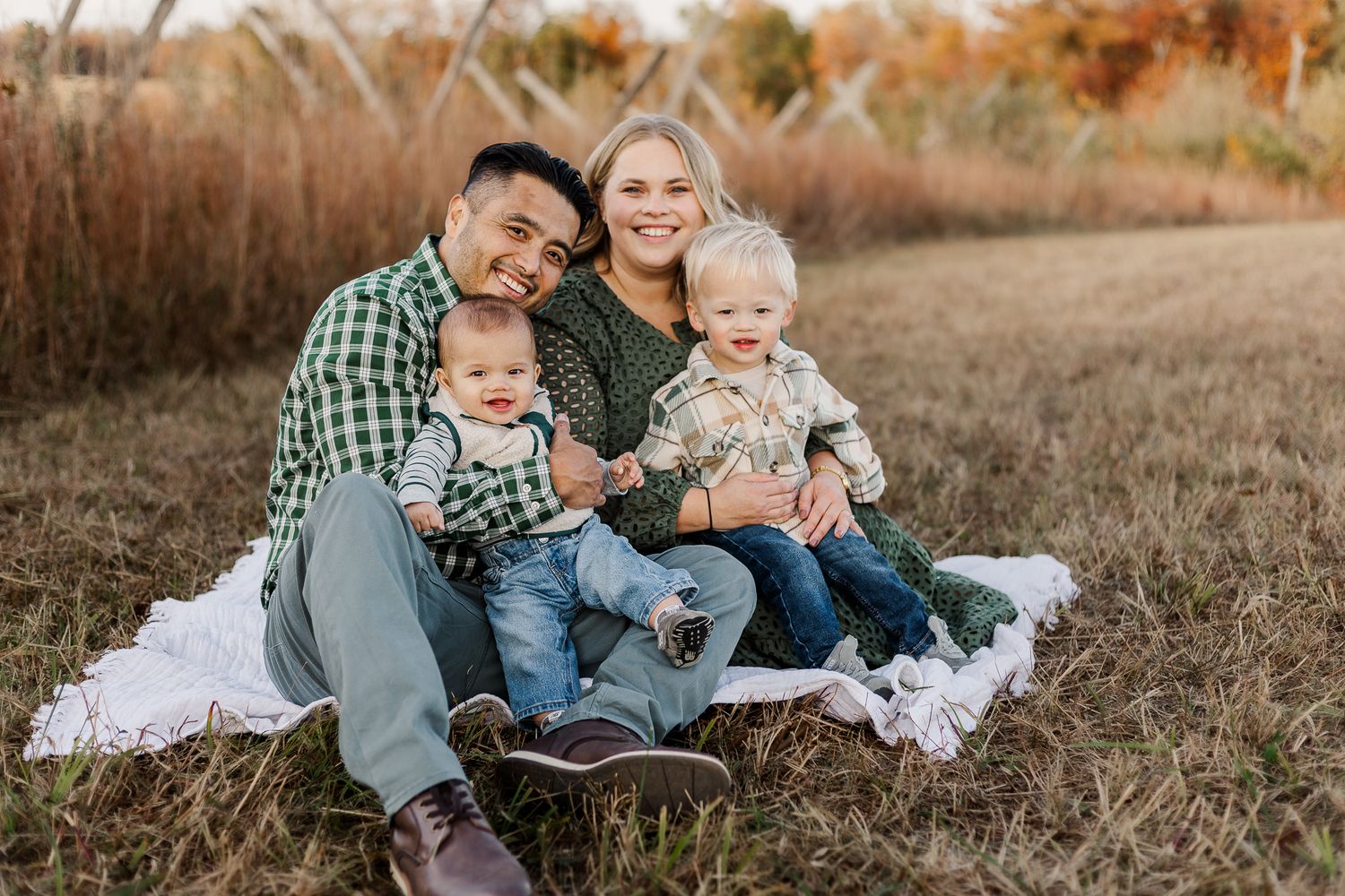 A family of four enjoying the fall at sunset photography session in manassas virginia