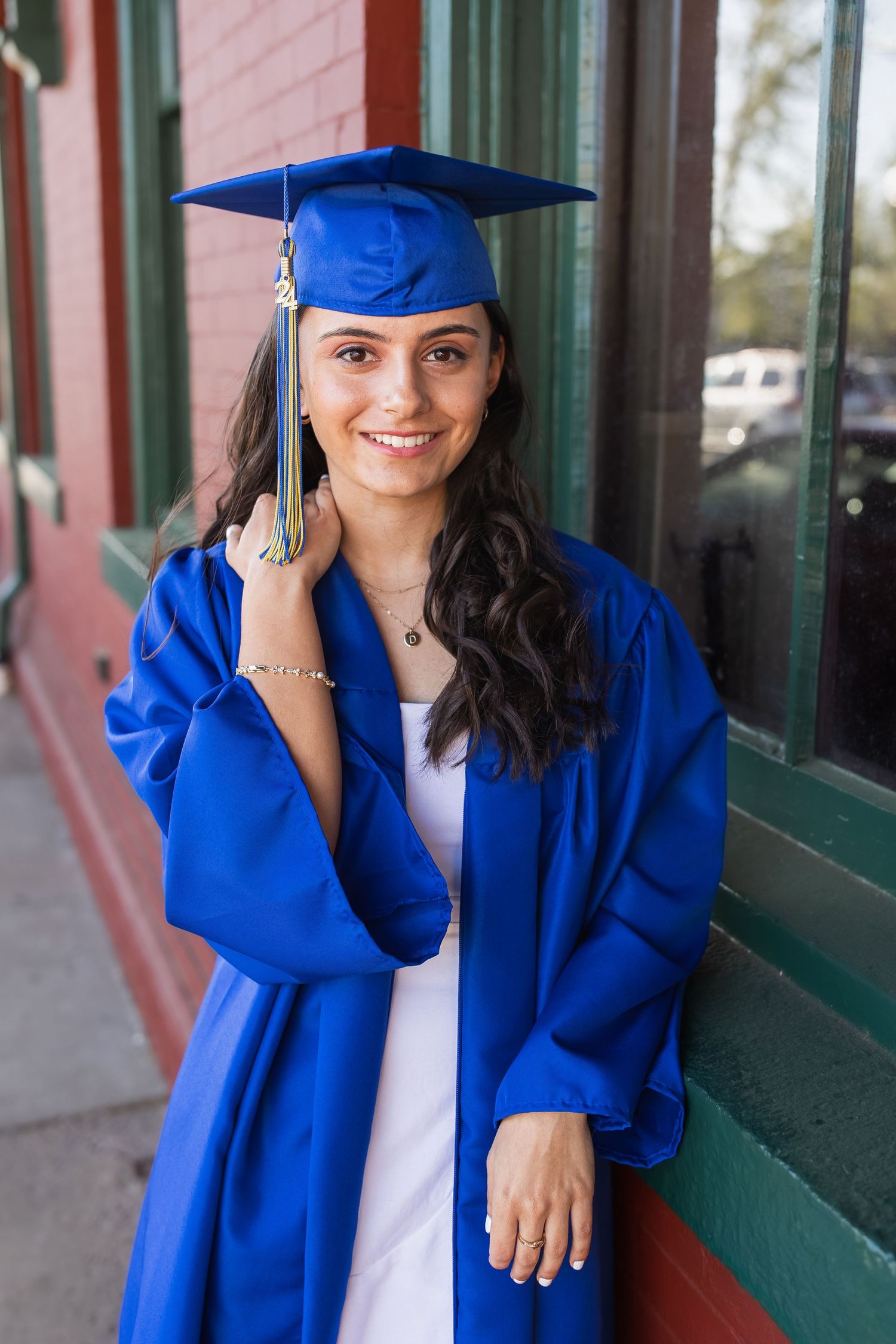 young girl smiling for graduation photos in vienna virginia