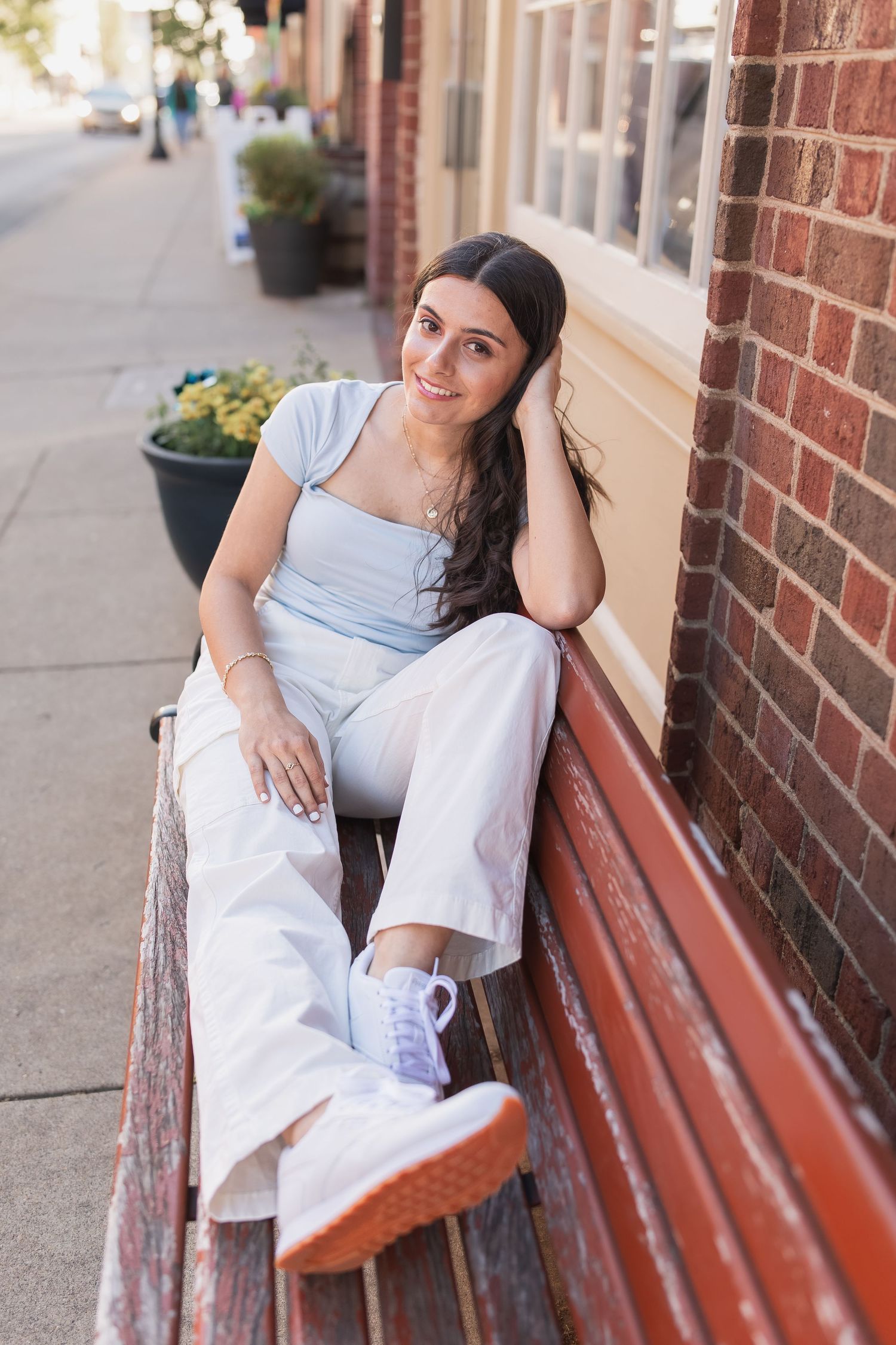 young girl smiling for graduation photos in vienna virginia