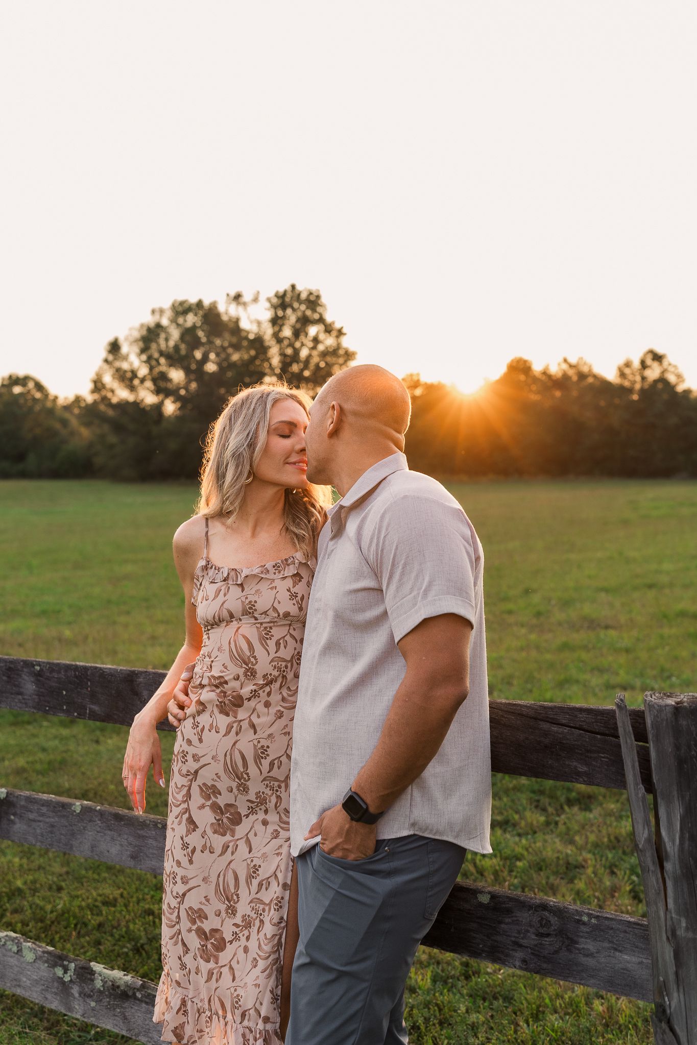 a young couple smiling together during sunset in leesburg virginia