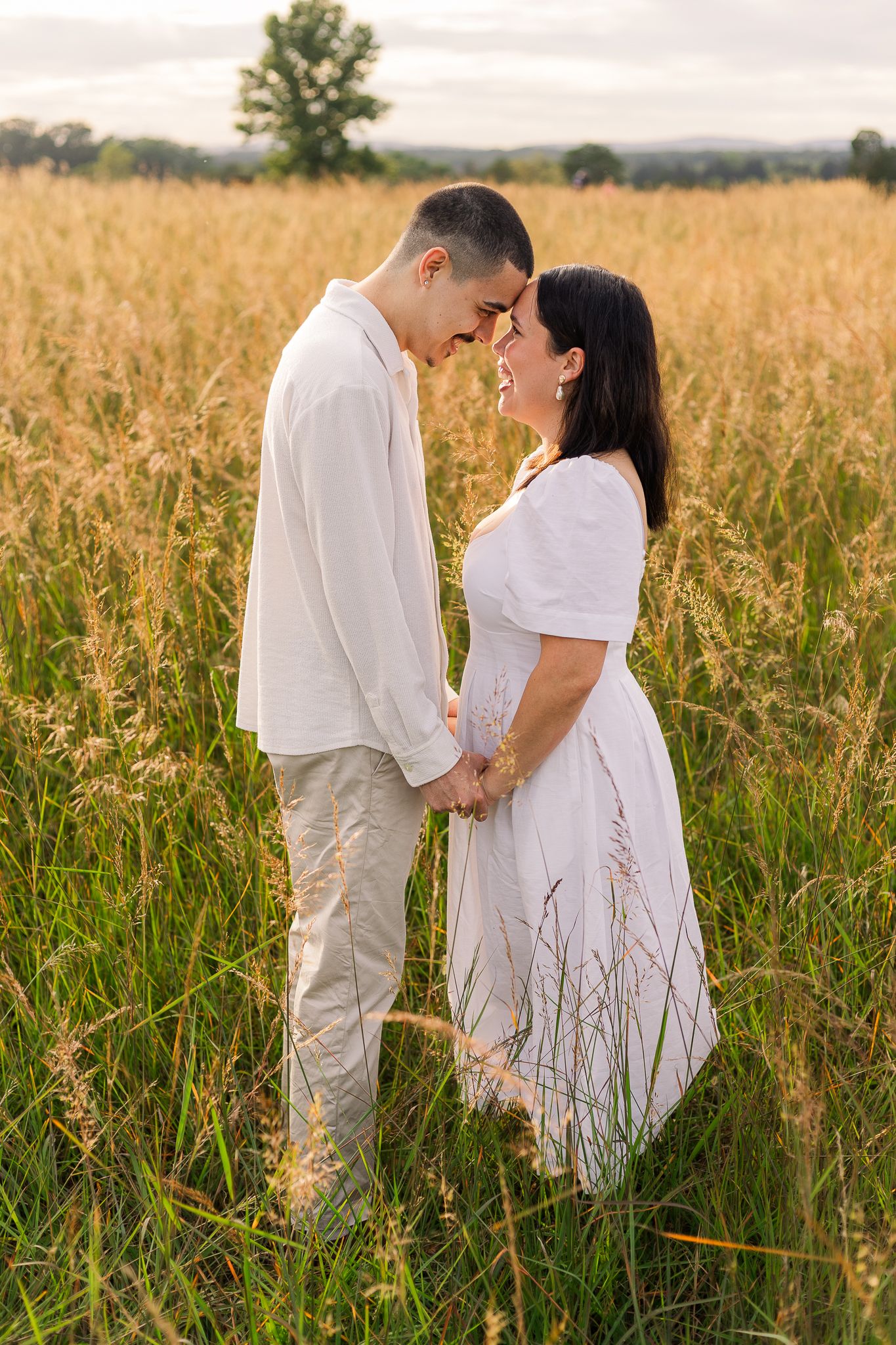 a young couple smiling together during sunset in manassas virginia