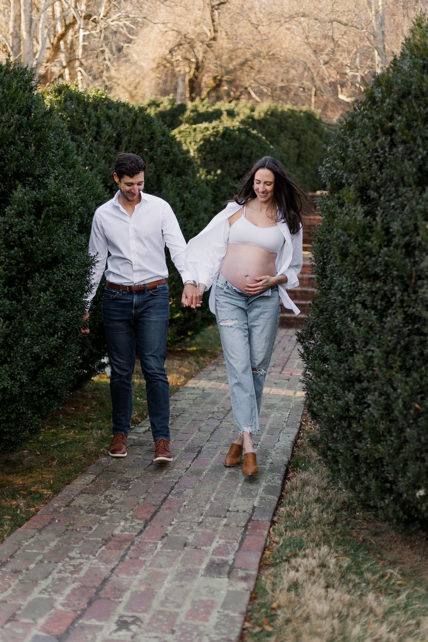 a smiling couple walking in the garden in morven park leesburg, virginia