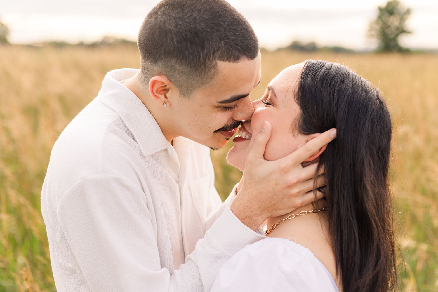 a young couple smiling together during sunset in manassas virginia