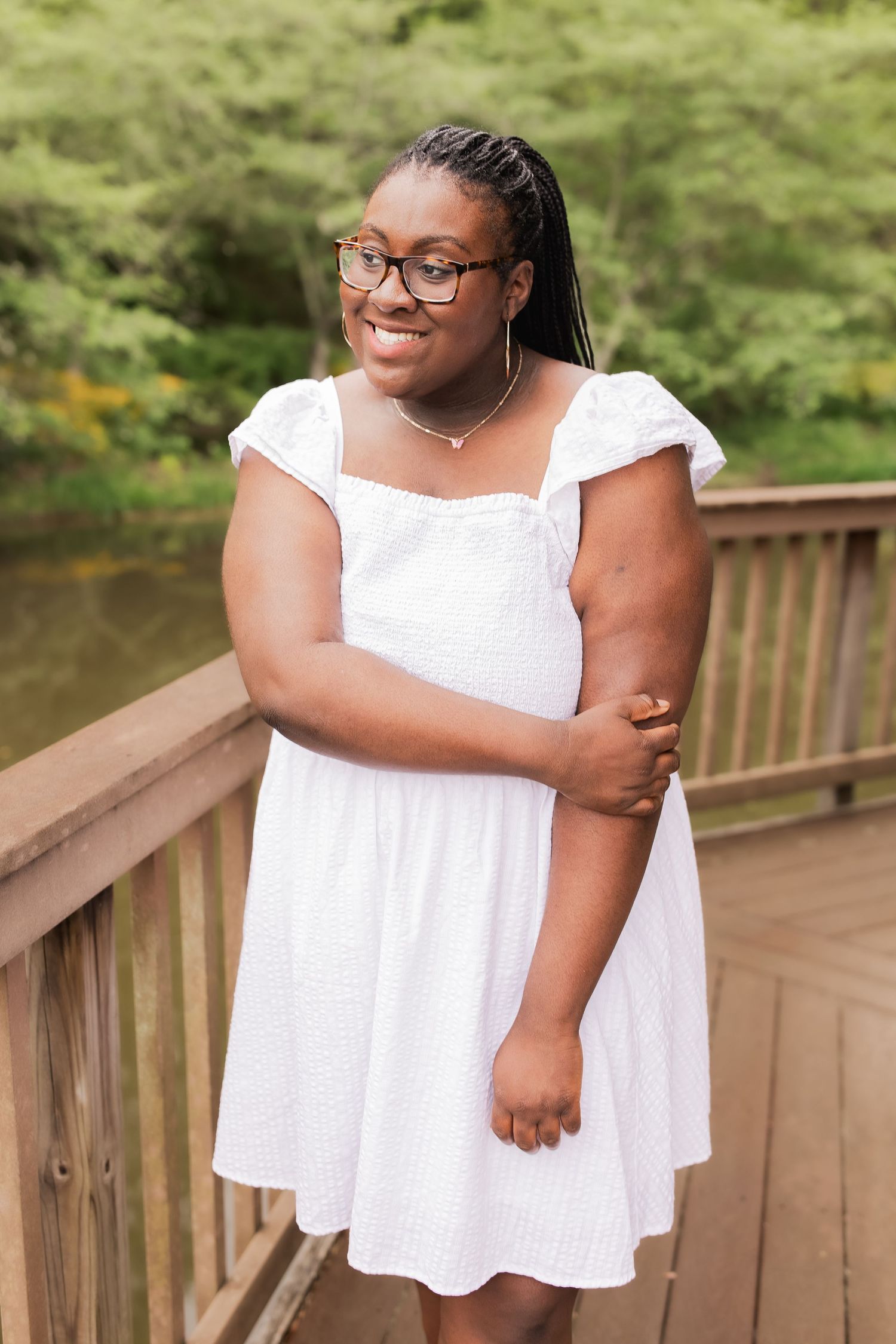 young girl smiling for graduation photos in vienna virginia