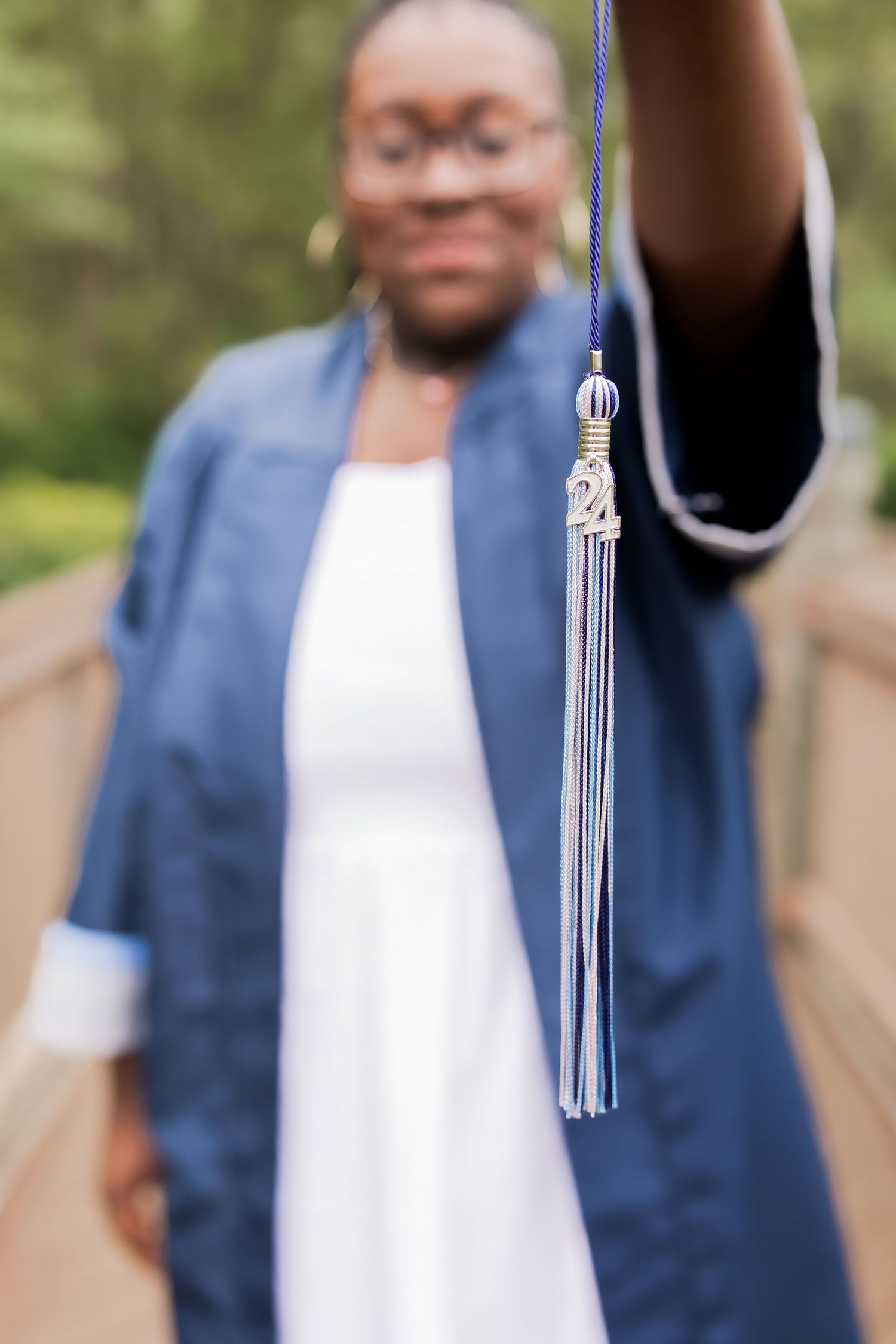 young girl smiling for graduation photos in vienna virginia